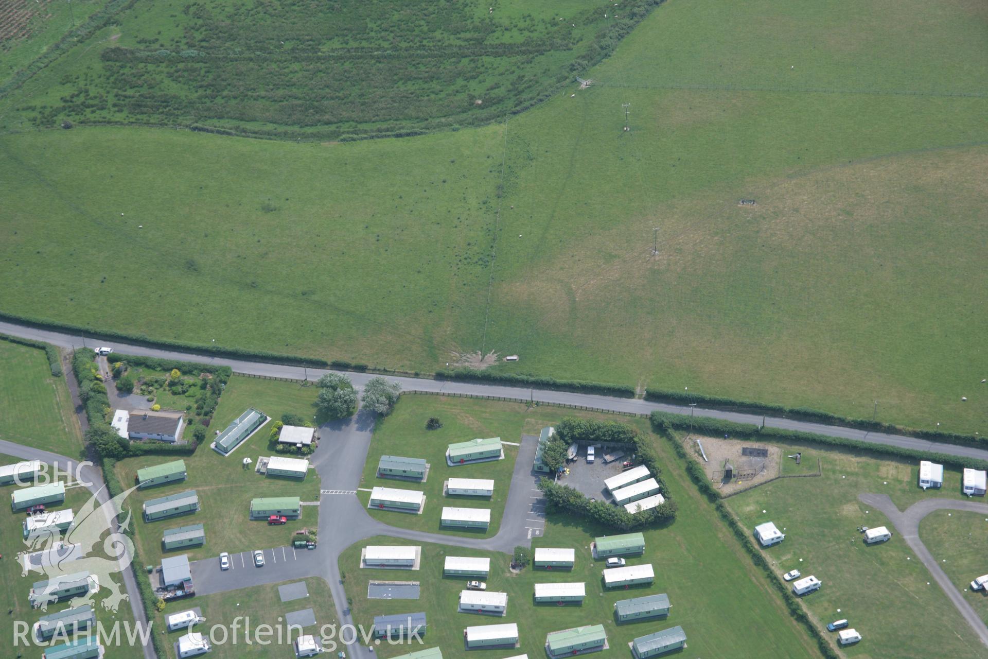 RCAHMW colour oblique aerial photograph of Glan-y-Mor Enclosure. Taken on 04 July 2006 by Toby Driver.