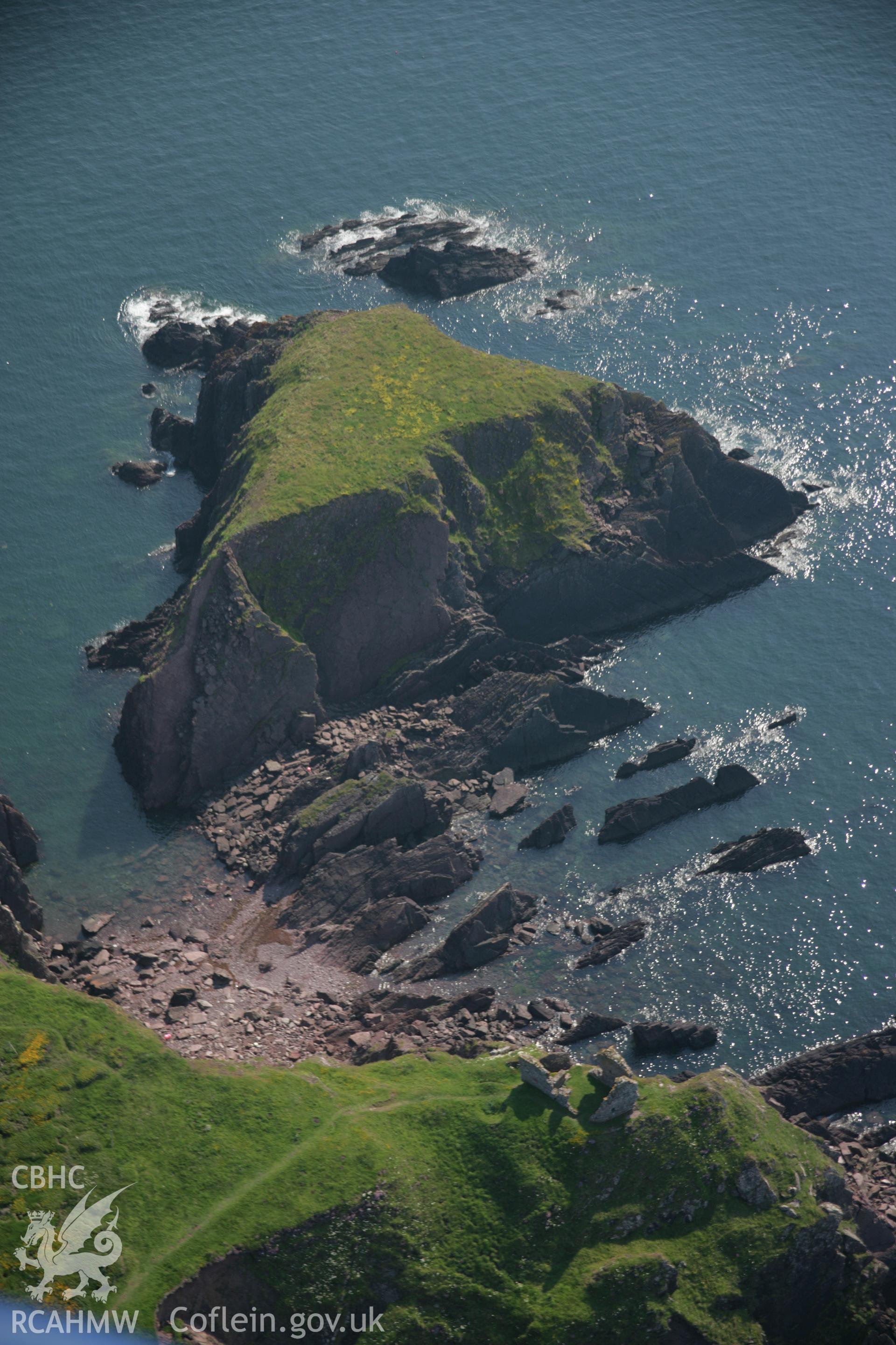 RCAHMW colour oblique aerial photograph of East Blockhouse, Angle, viewed from the north-east and showing Rat Island. Taken on 08 June 2006 by Toby Driver.
