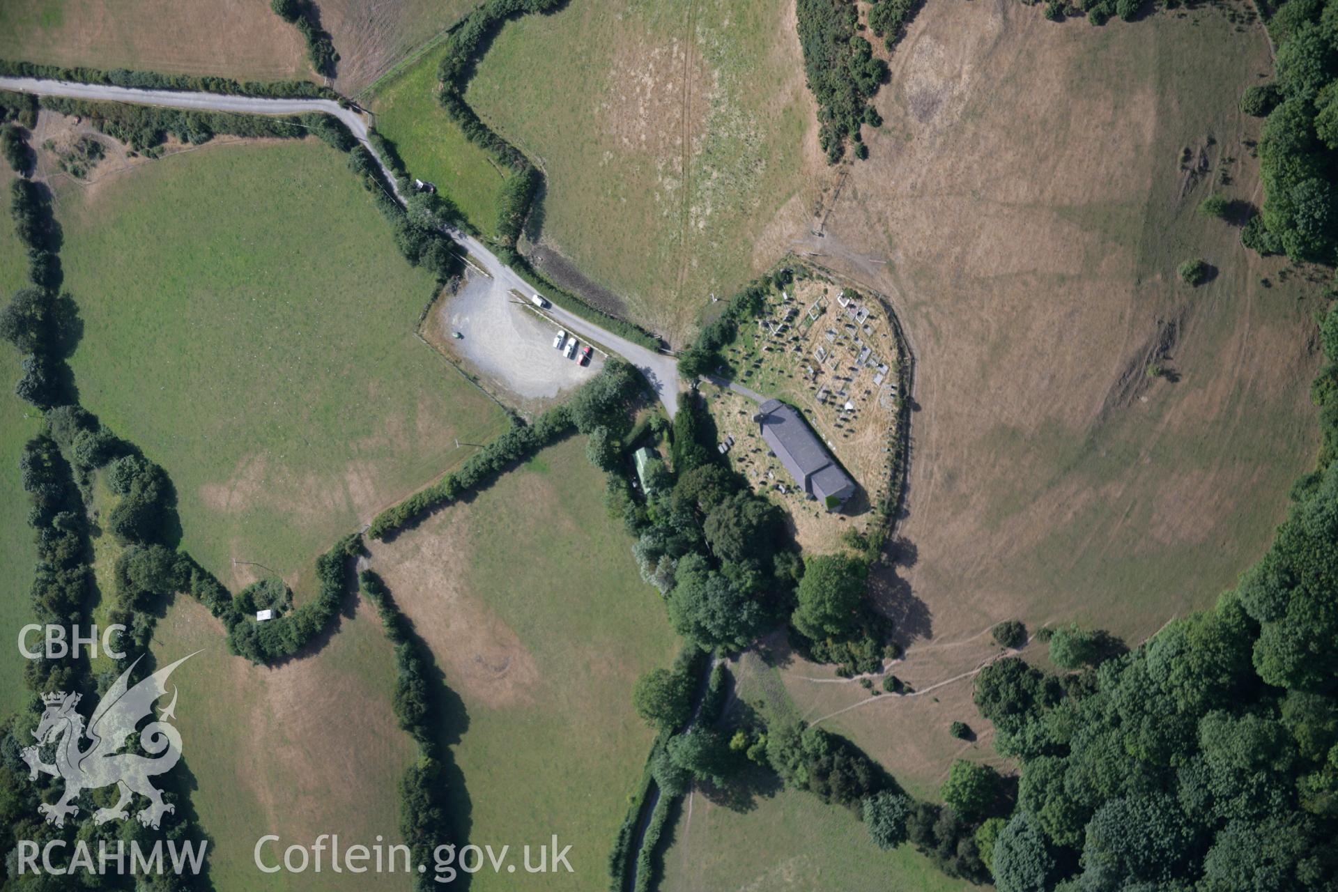 RCAHMW colour oblique aerial photograph of St Michael's Church, Llanfihangel Penbryn. Taken on 27 July 2006 by Toby Driver.