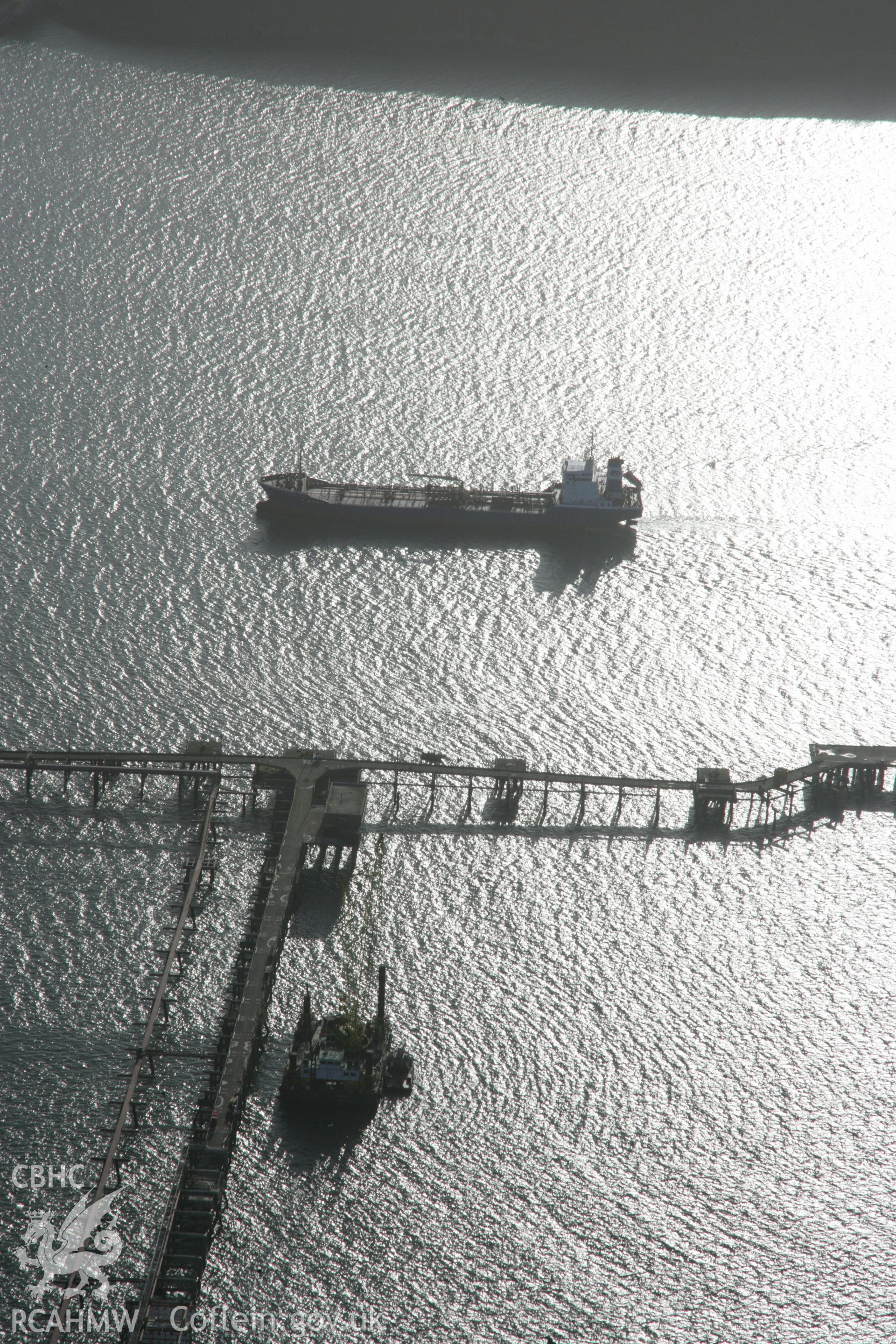 RCAHMW colour oblique aerial photograph of the west jetty at South Hook Point, Milford Haven, from the north showing a tanker. Taken on 11 January 2006 by Toby Driver.