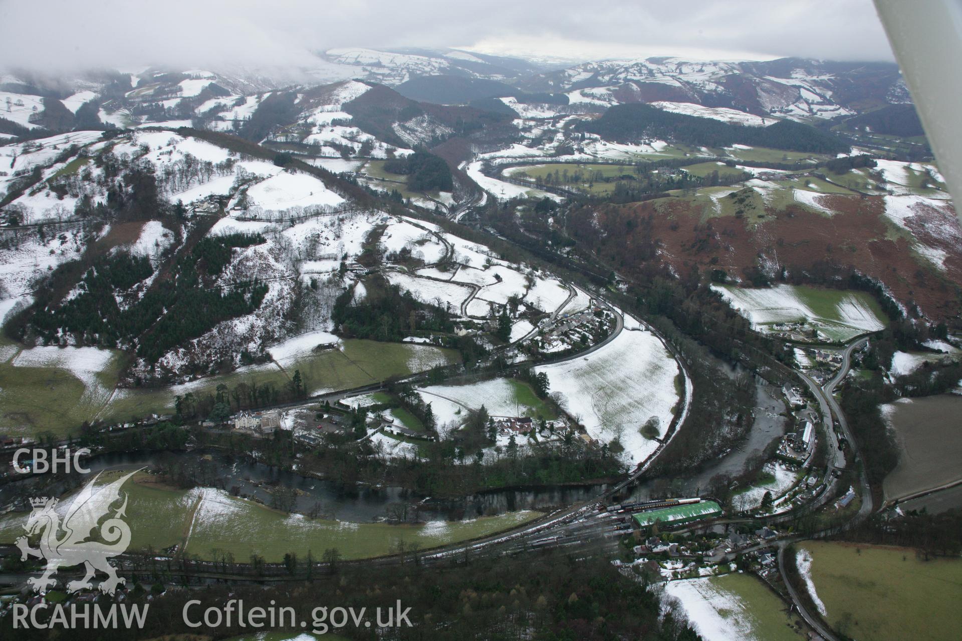 RCAHMW colour oblique aerial photograph of Llangollen, viewed from the north-east with snow. Taken on 06 March 2006 by Toby Driver.