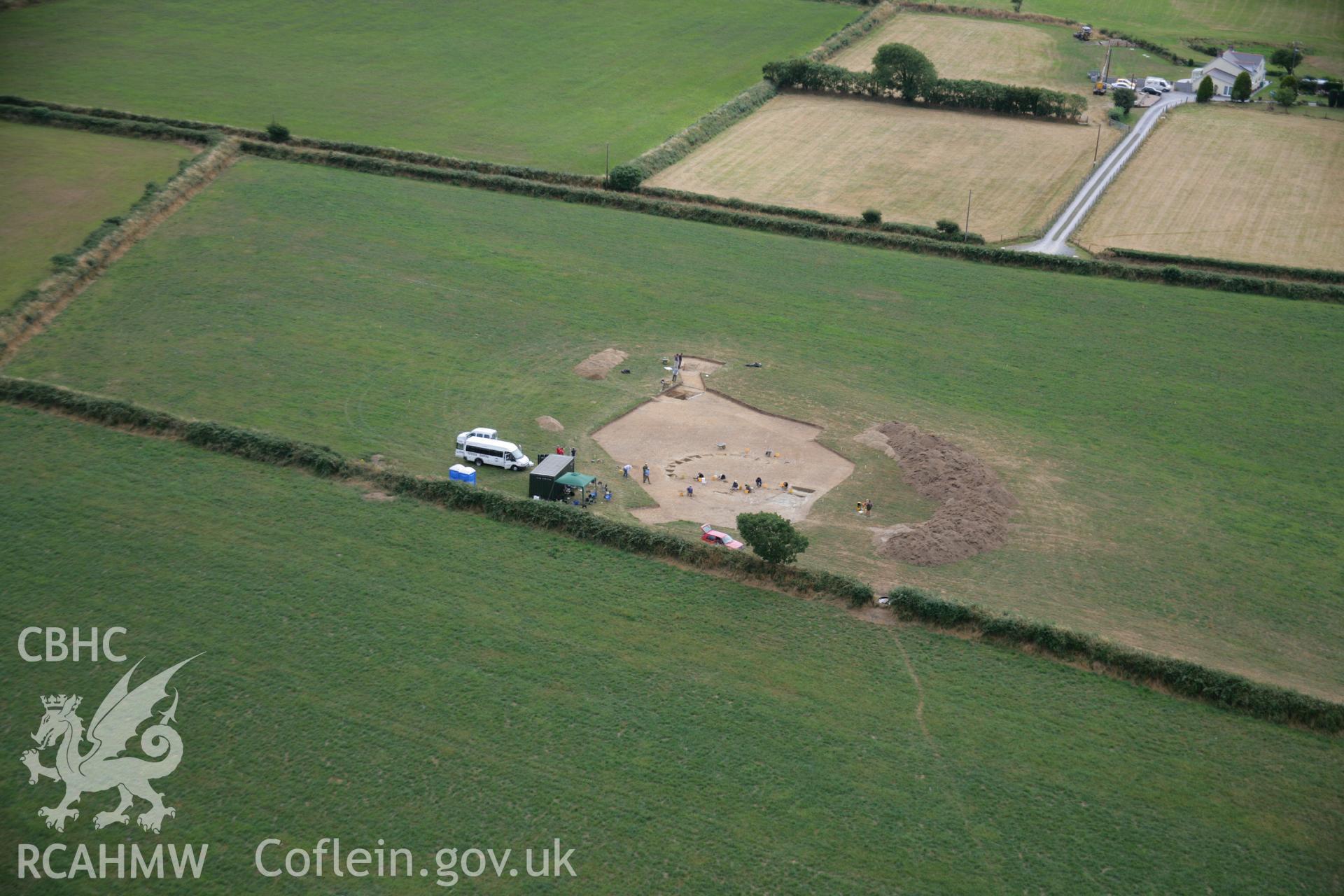 RCAHMW colour oblique aerial photograph of Ffynnonwen Defended Enclosure during excavations by the Dyfed Archaeological Trust. Taken on 27 July 2006 by Toby Driver.