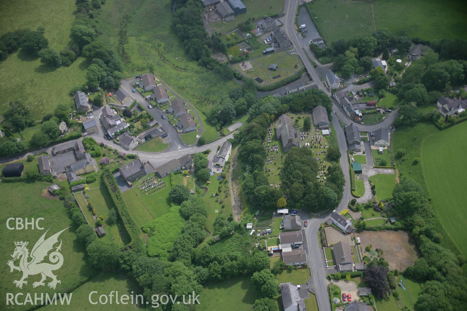 RCAHMW colour oblique aerial photograph of Meidrim village, with St Davids Church, viewed from the west. Taken on 15 June 2006 by Toby Driver