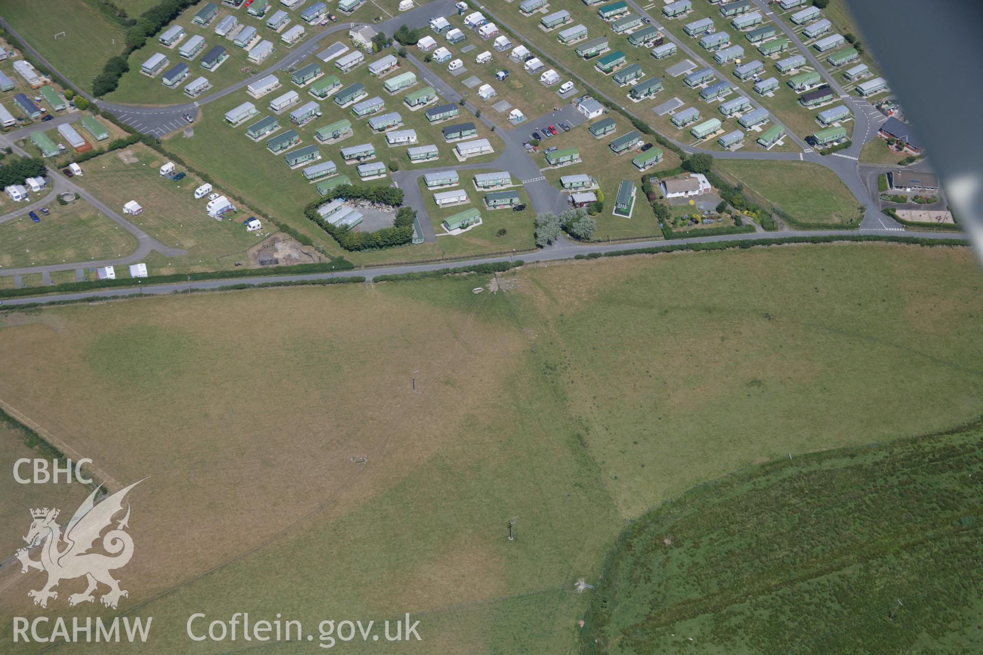 RCAHMW colour oblique aerial photograph of Glan-y-Mor Enclosure. Taken on 17 July 2006 by Toby Driver.