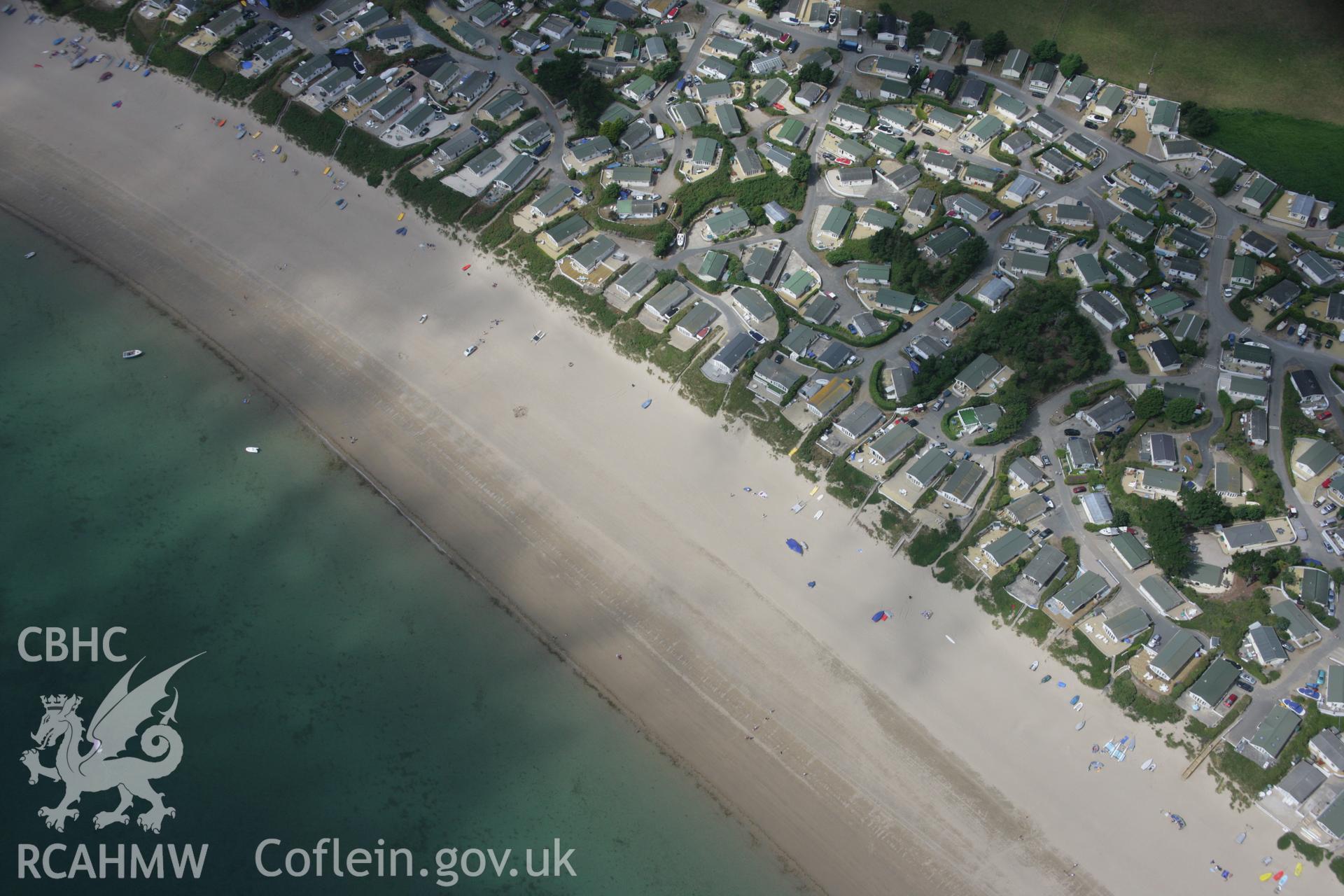 RCAHMW colour oblique aerial photograph of  beach and holiday chalets, The Warren,  Abersoch, viewed from the east. Taken on 03 August 2006 by Toby Driver