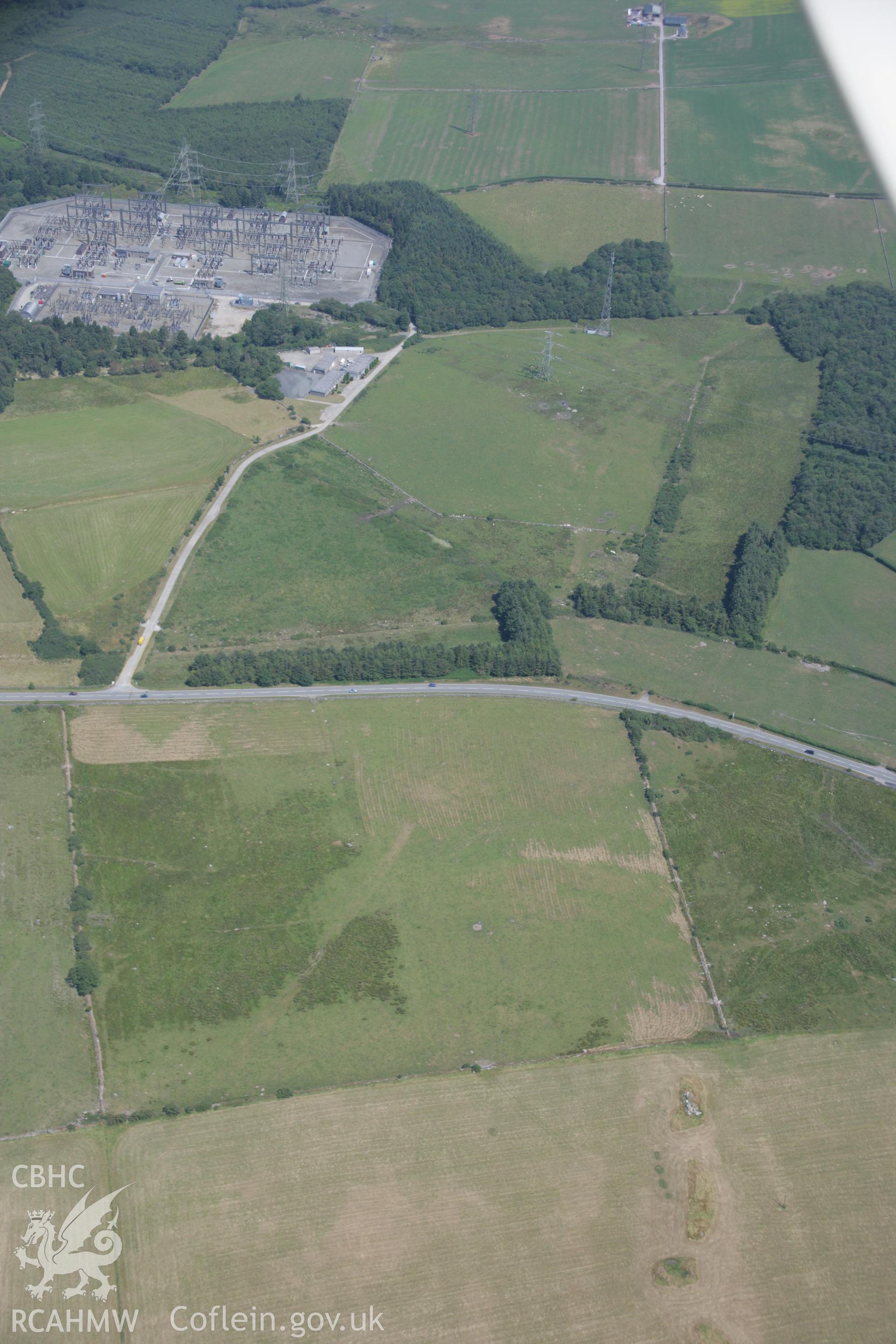 RCAHMW colour oblique aerial photograph of sections of Roman road at Ty'n-Llwyn. Taken on 18 July 2006 by Toby Driver.