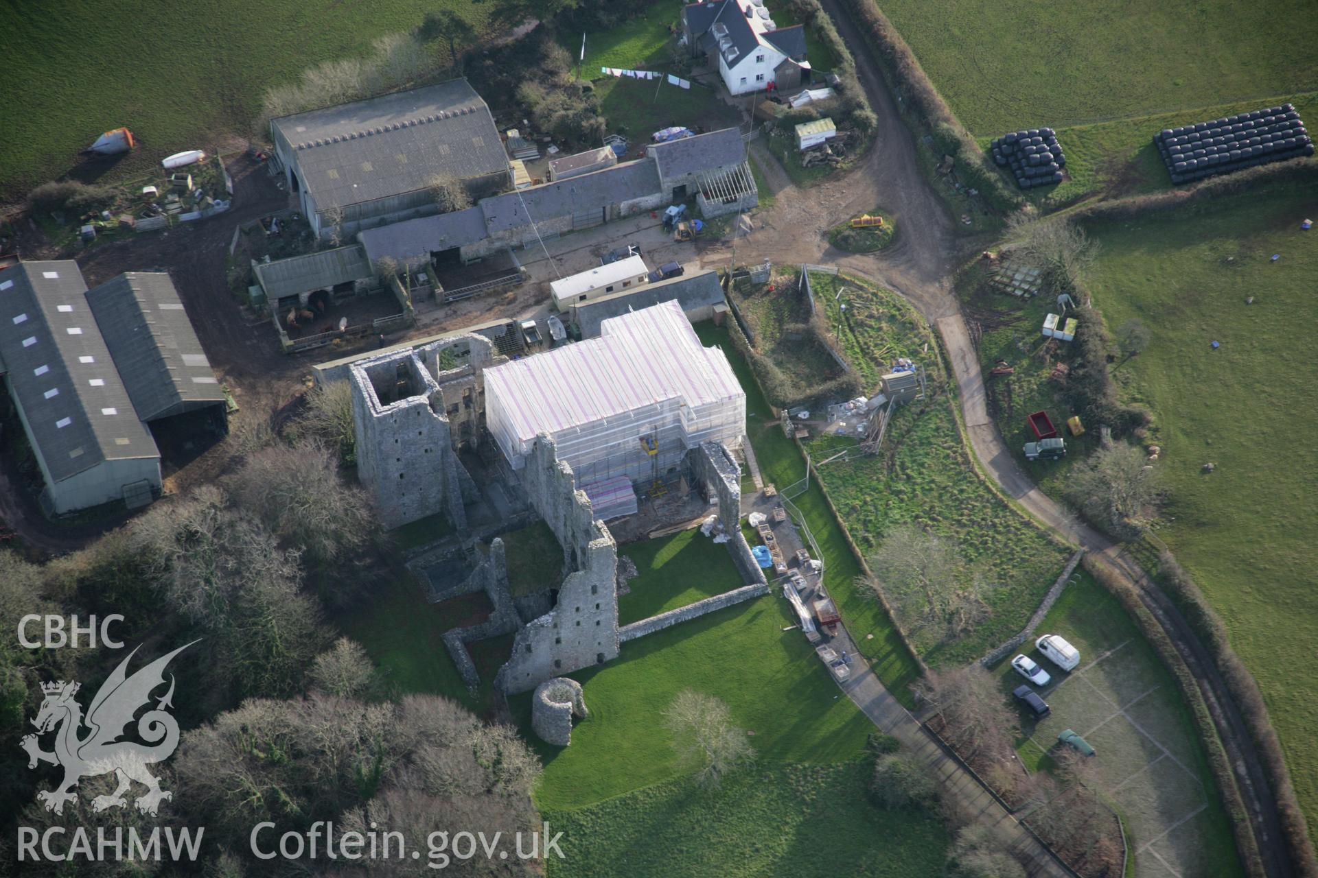 RCAHMW colour oblique aerial photograph of Oxwich Castle, with restoration in progress, in wide view from the north-west. Taken on 26 January 2006 by Toby Driver.