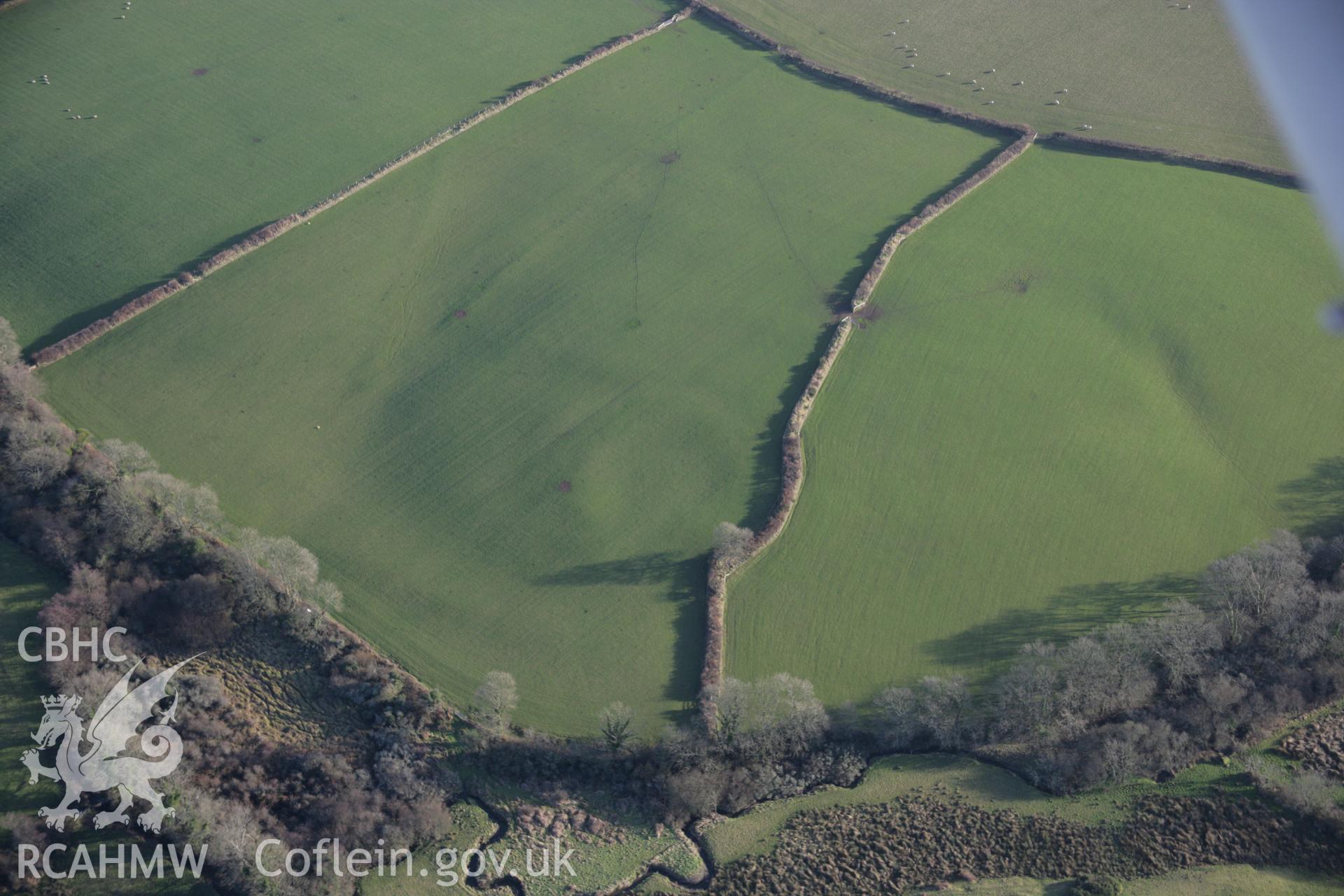 RCAHMW colour oblique aerial photograph of East Hook Rath (sometimes Walesland Rath) from the north-west. Taken on 11 January 2006 by Toby Driver.