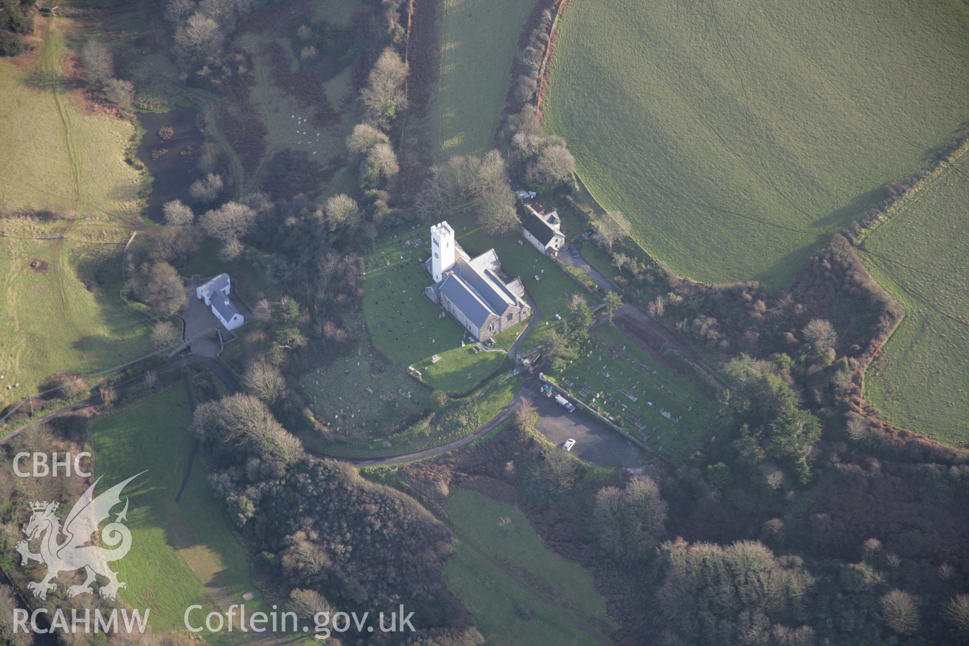 RCAHMW colour oblique aerial photograph of St James' Church, Manorbier, from the west. Taken on 11 January 2006 by Toby Driver.