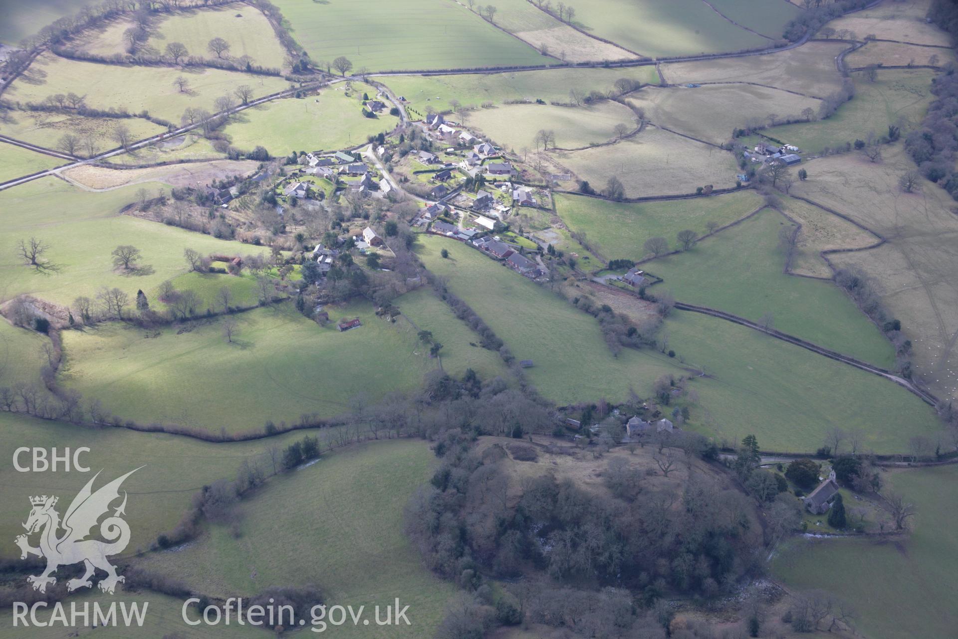 RCAHMW colour oblique aerial photograph of Hyssington Castle, motte and bailey, viewed from the north-east Taken on 06 March 2006 by Toby Driver.