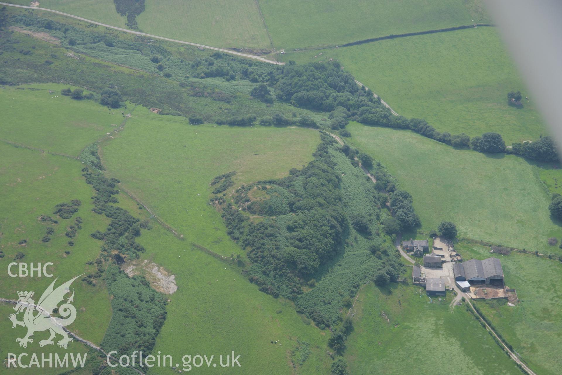 RCAHMW colour oblique aerial photograph of Castell Cynfal Castle Mound. Taken on 04 July 2006 by Toby Driver.