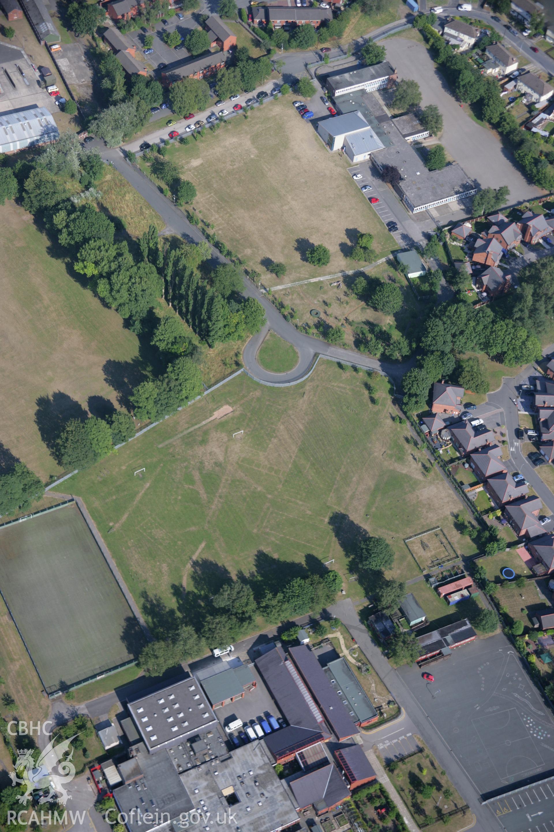 RCAHMW colour oblique aerial photograph of cropmarks of Former Barracks at Hightown. Taken on 17 July 2006 by Toby Driver.