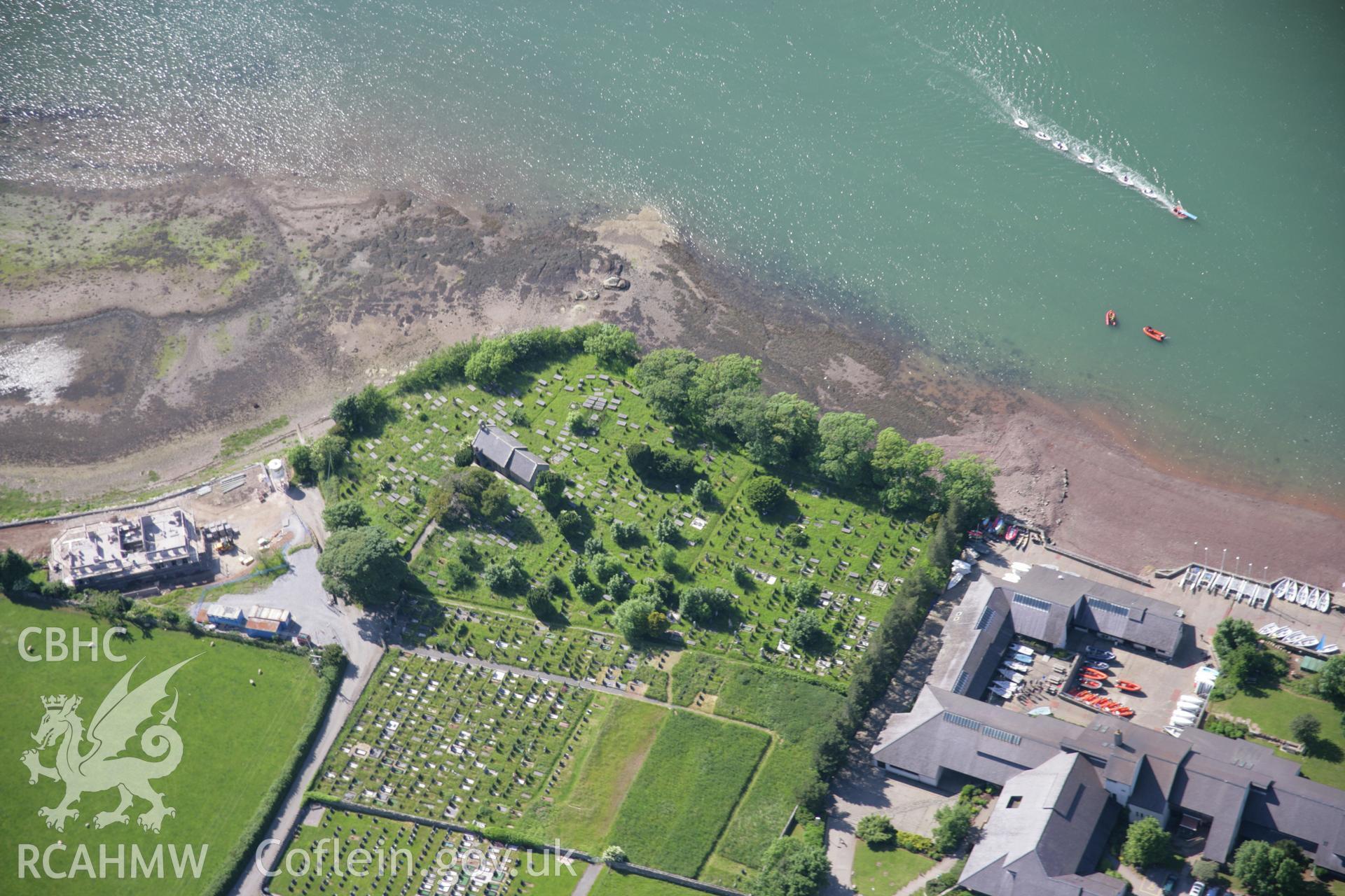 RCAHMW colour oblique aerial photograph of St Marys Church, Llanfair-Is-Gaer, from the south-east. Taken on 14 June 2006 by Toby Driver.