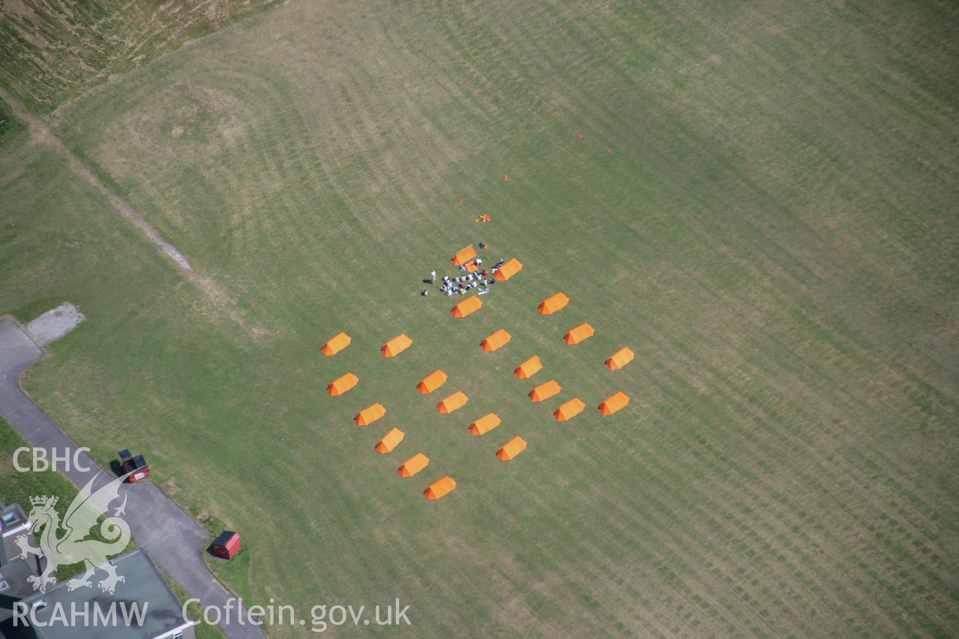 RCAHMW colour oblique photograph of Ogmore by sea, campsite on playing field. Taken by Toby Driver on 29/06/2006.