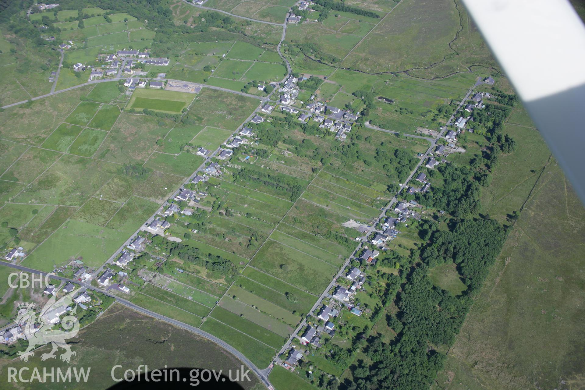 RCAHMW colour oblique aerial photograph of industrial housing at Tan-y-Bwlch, viewed from north-west. Taken on 14 June 2006 by Toby Driver