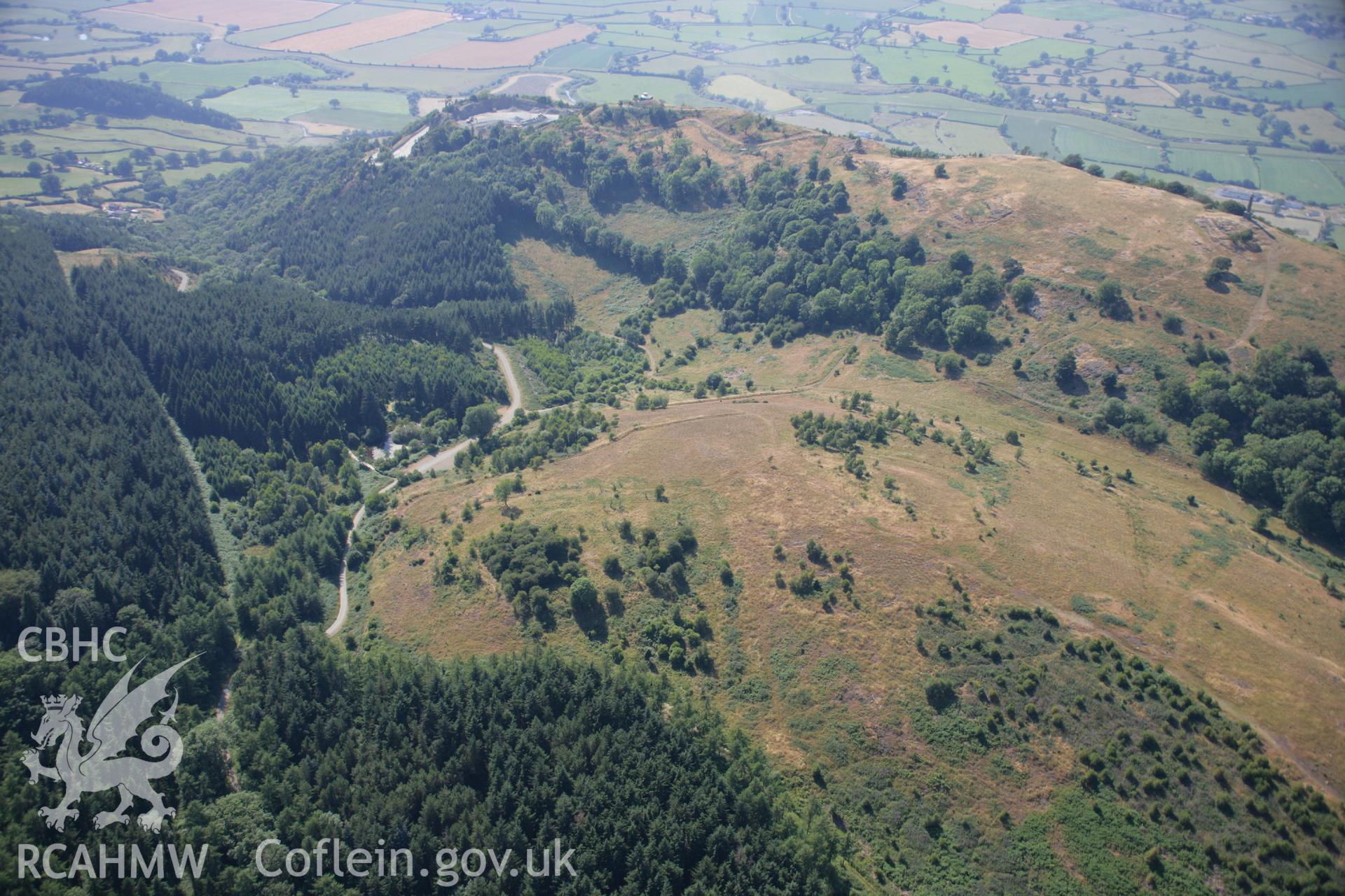 RCAHMW colour oblique aerial photograph of Newpieces Enclosure, Breiddin Hill. Taken on 17 July 2006 by Toby Driver.