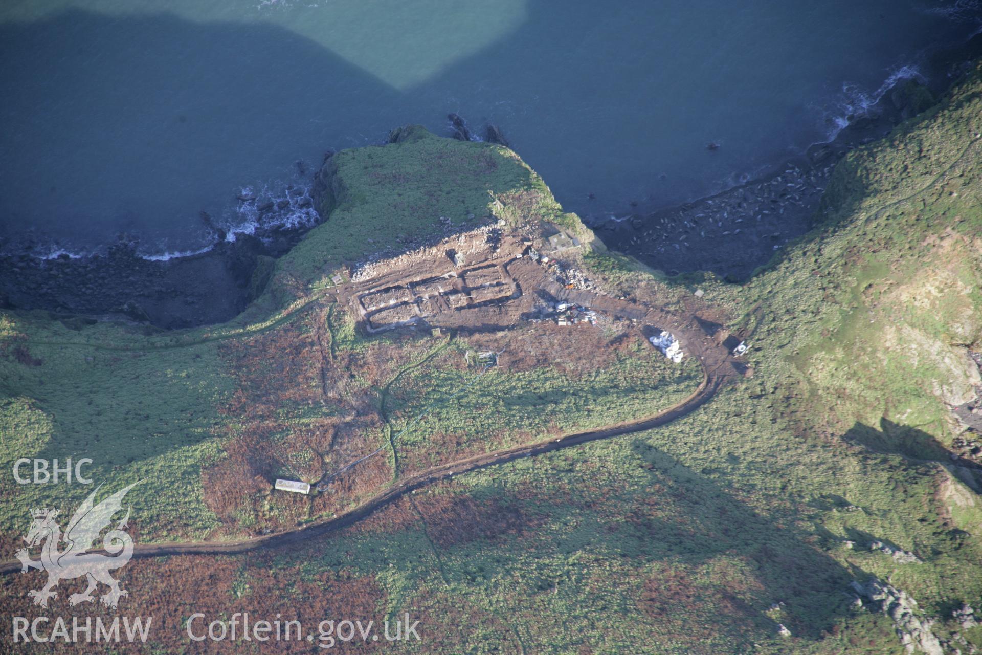 RCAHMW colour oblique aerial photograph of Skomer Island Settlements and Field Systems fom the west showing the Warden's House under construction. Taken on 11 January 2006 by Toby Driver.