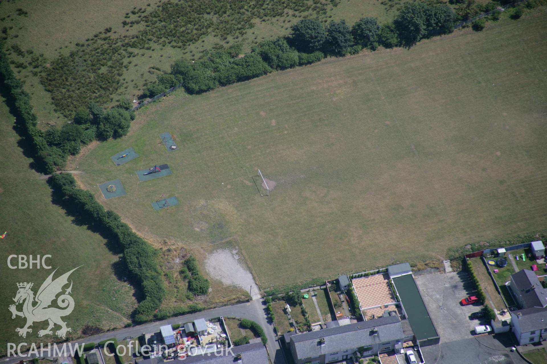 RCAHMW colour oblique aerial photograph of the Tyddyn Pandy Square Barrow Cemetery. Taken on 25 July 2006 by Toby Driver.