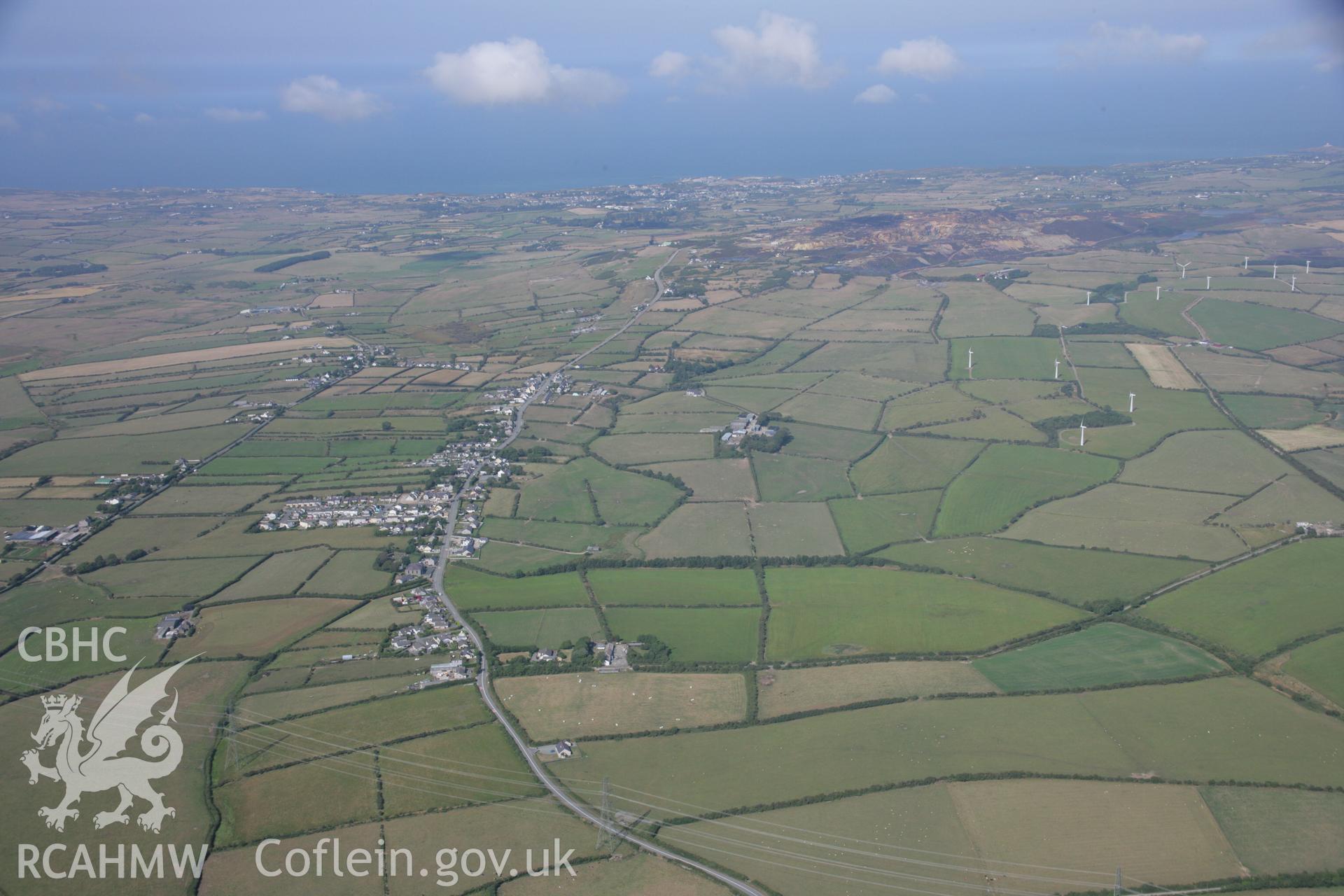 RCAHMW colour oblique aerial photograph of Christ Church in landscape view of Rhosybol. Taken on 14 August 2006 by Toby Driver
