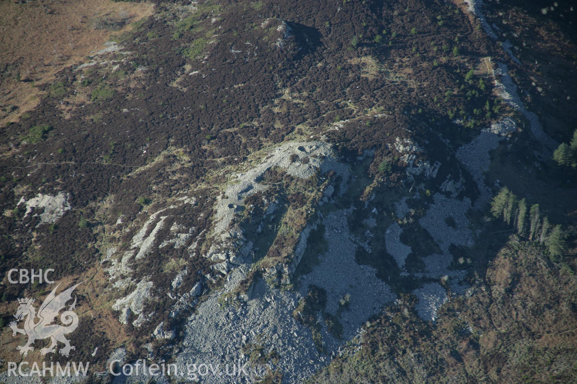 RCAHMW colour oblique aerial photograph of Garn Boduan. A view of the summit citadel from the east. Taken on 09 February 2006 by Toby Driver.