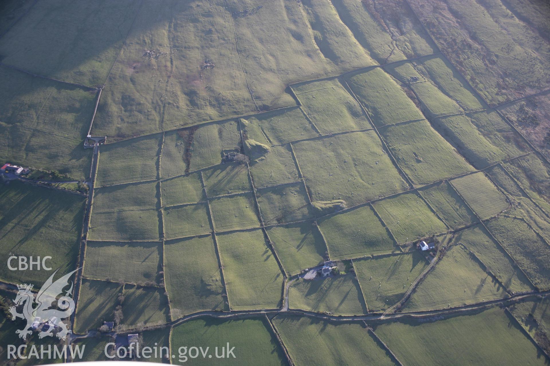 RCAHMW colour oblique aerial photograph of Tyddyn-Du showing mine workings and a field system from the north. Taken on 09 February 2006 by Toby Driver.