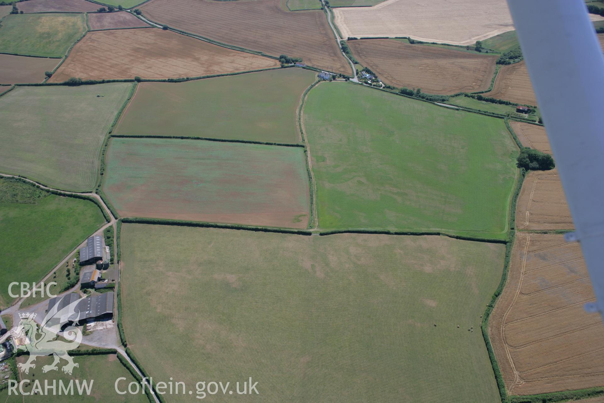 RCAHMW colour oblique aerial photograph of Corntown Enclosure. Taken on 24 July 2006 by Toby Driver.