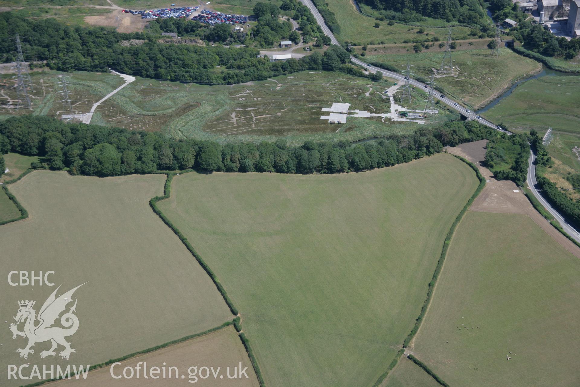 RCAHMW colour oblique aerial photograph of the enclosure at East Orchard Wood. Taken on 24 July 2006 by Toby Driver.