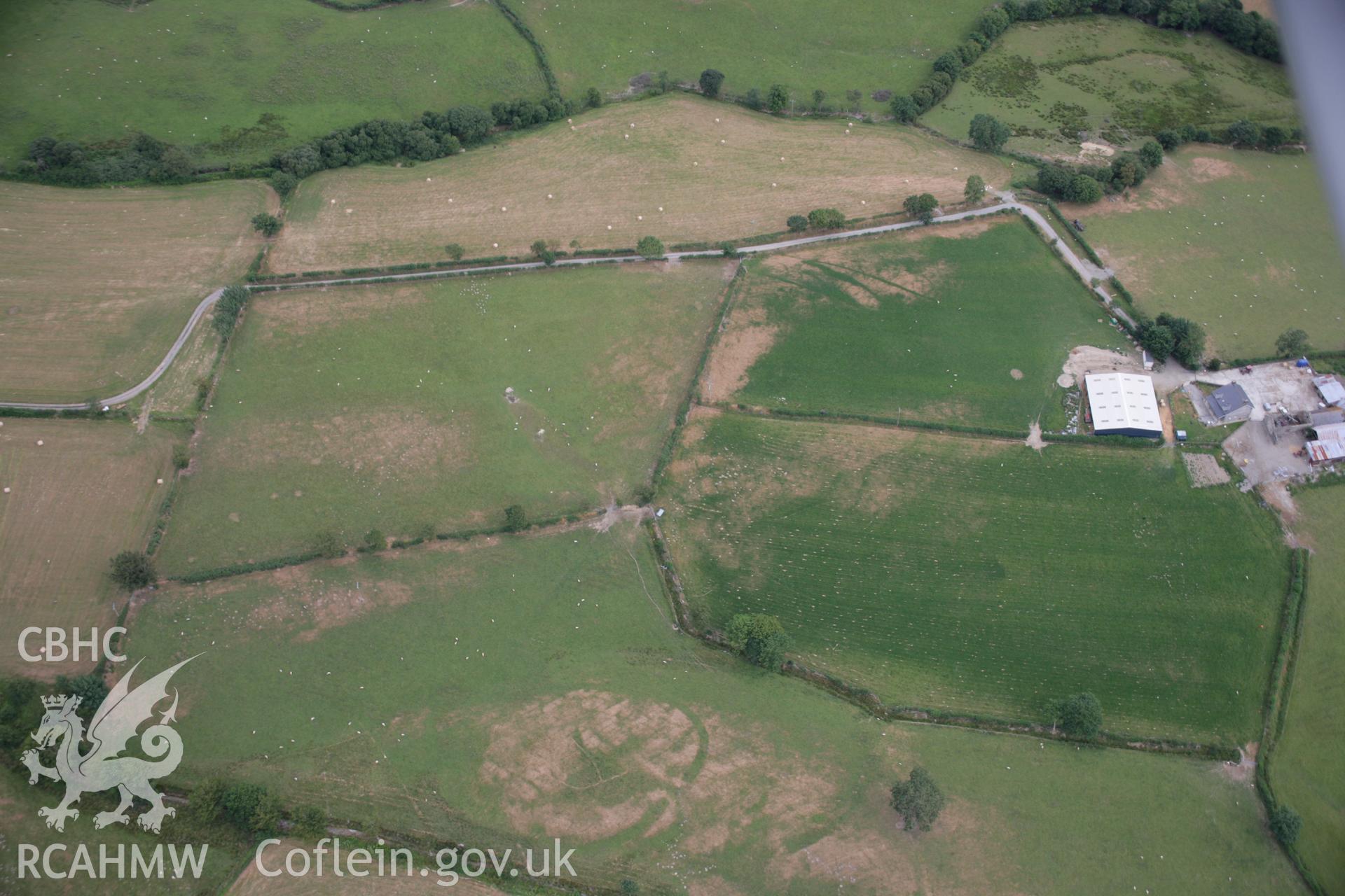 RCAHMW colour oblique aerial photograph of Llwyn-Bwch defended enclosure southwest. Taken on 27 July 2006 by Toby Driver.