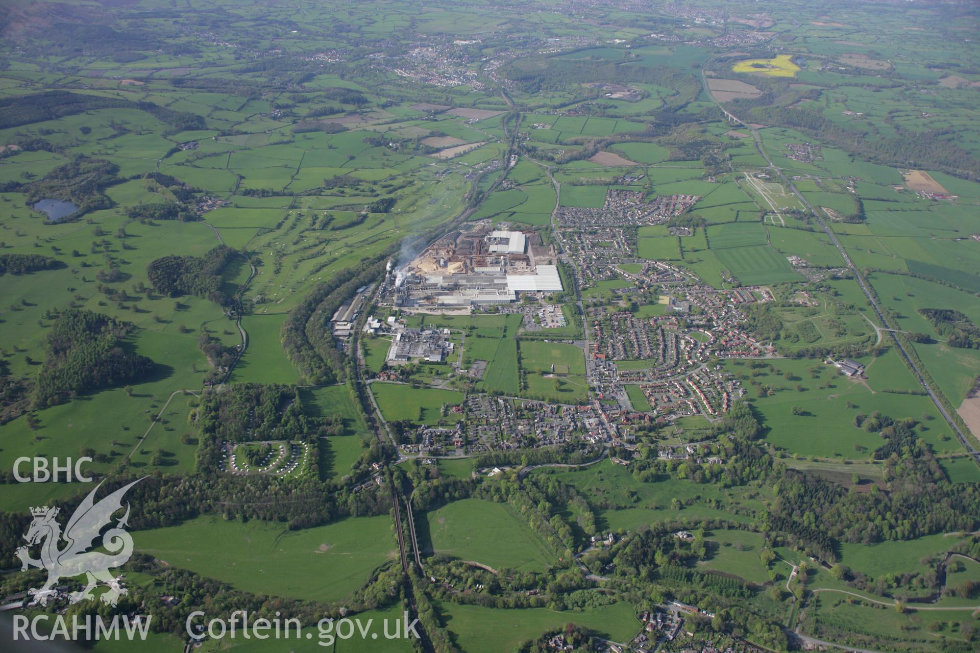 RCAHMW digital colour oblique photograph of the woodchip factory in Chirk from the south. Taken on 05/05/2006 by T.G. Driver.