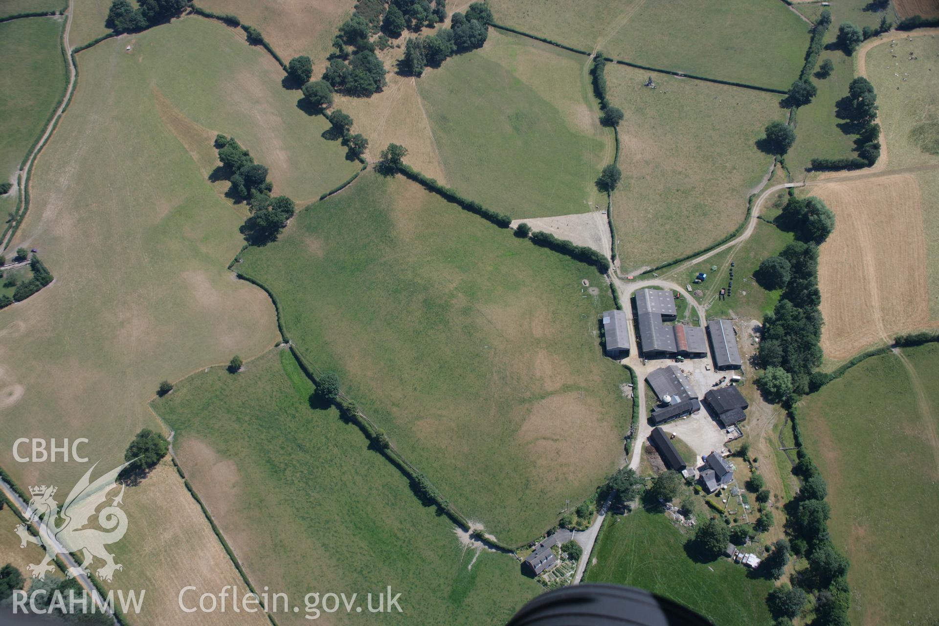 RCAHMW colour oblique aerial photograph of cropmarks near Lower Bryntalch. Taken on 17 July 2006 by Toby Driver.