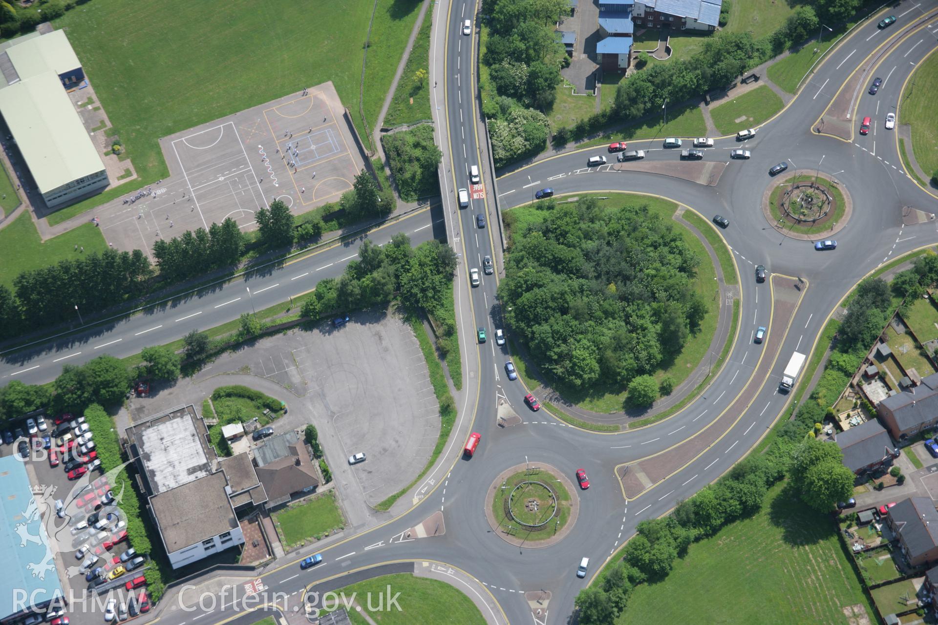 RCAHMW colour oblique aerial photograph of roundabaout in the centre of Cwmbran viewed from the north-east. Taken on 09 June 2006 by Toby Driver.