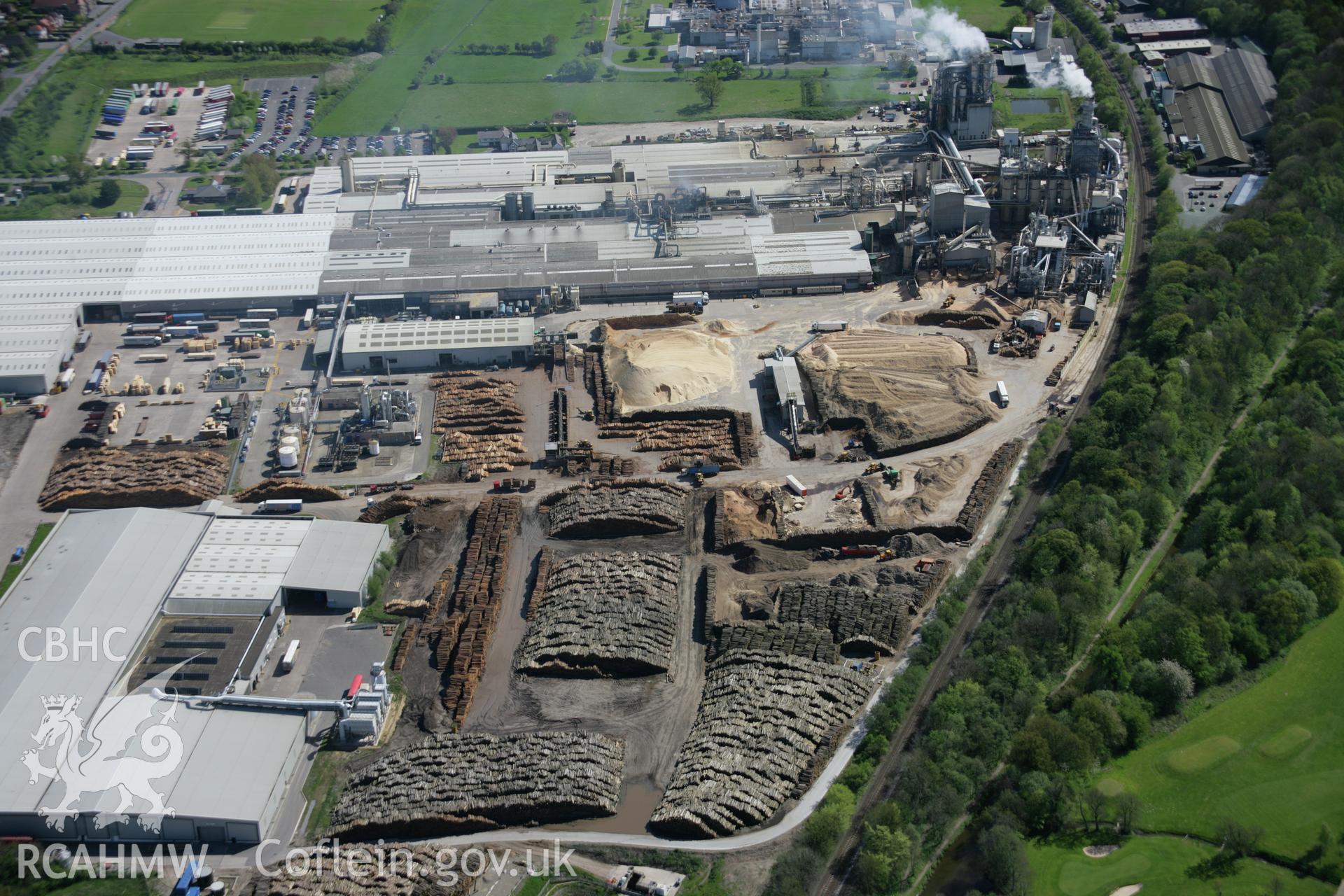 RCAHMW digital colour oblique photograph of the woodchip factory in Chirk from the north. Taken on 05/05/2006 by T.G. Driver.