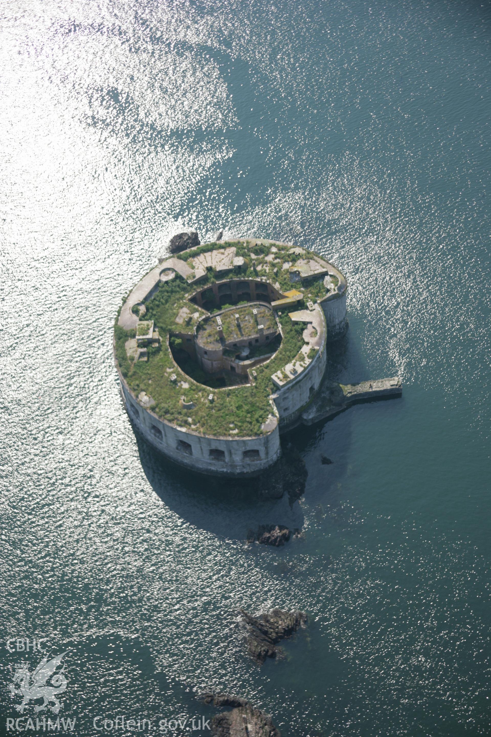 RCAHMW colour oblique aerial photograph of Stack Rock Fort from the east. Taken on 08 June 2006 by Toby Driver.
