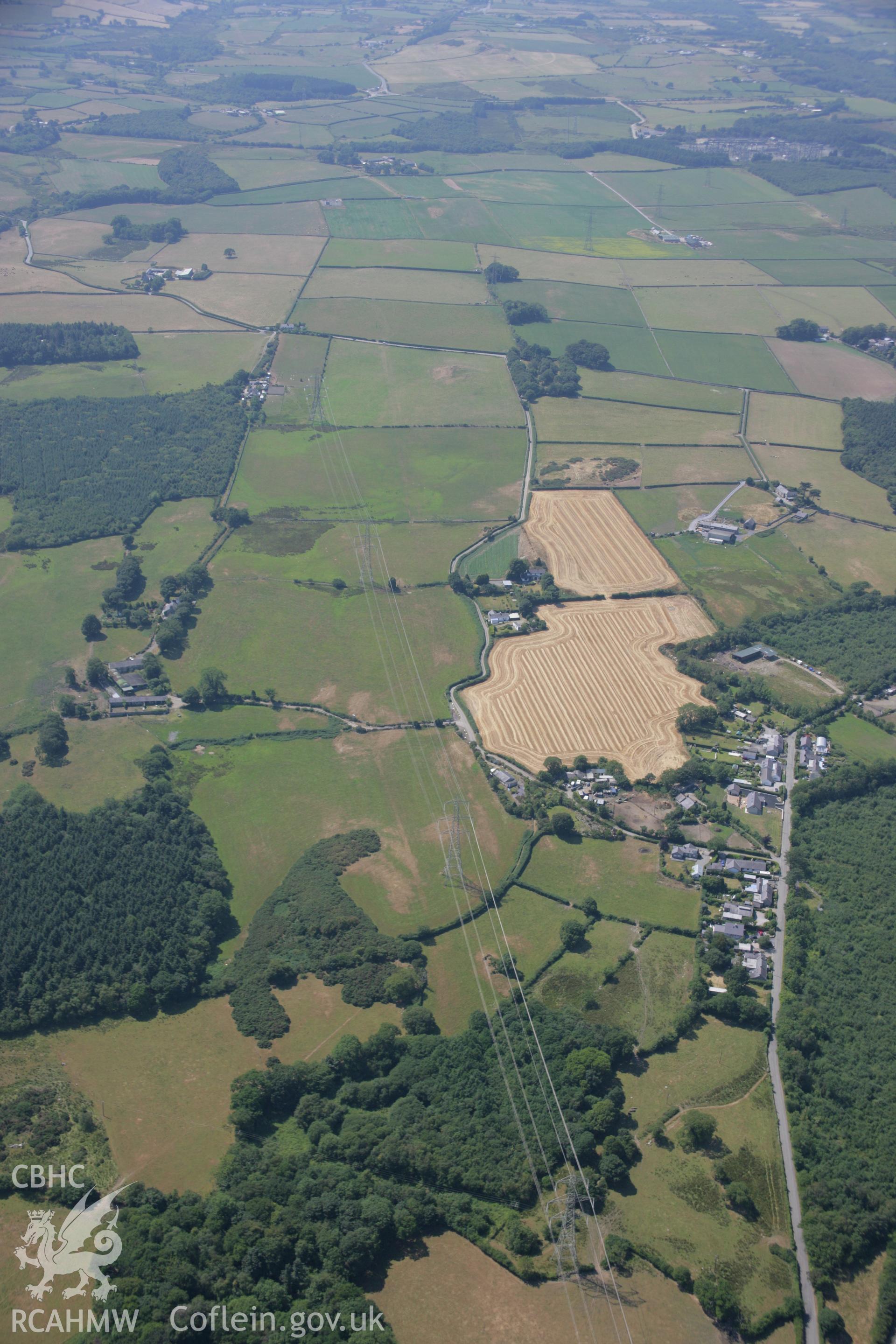 RCAHMW colour oblique aerial photograph of St George's Church and nearby parchmarks at Waen Wen. Taken on 18 July 2006 by Toby Driver
