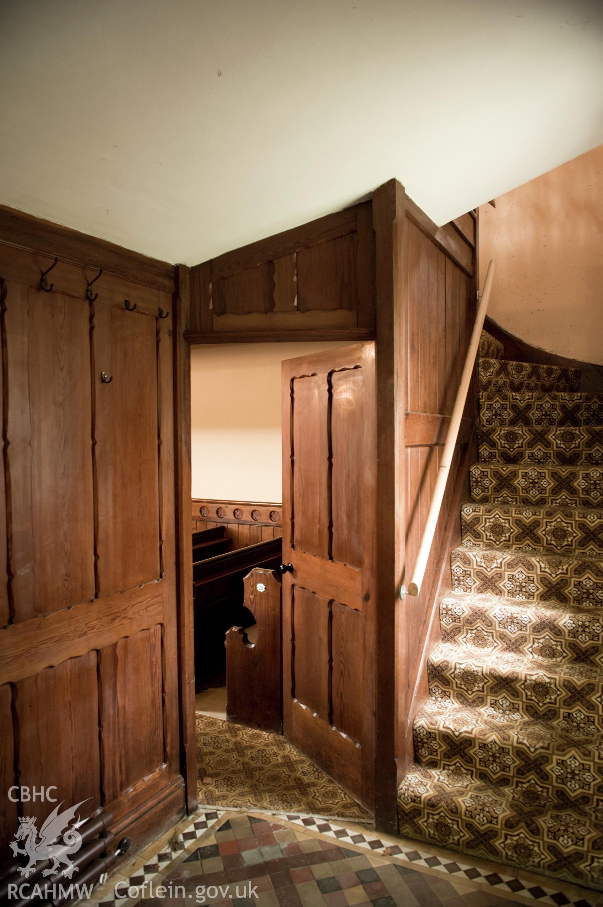 Digital image of interior: showing stairs and doorway.