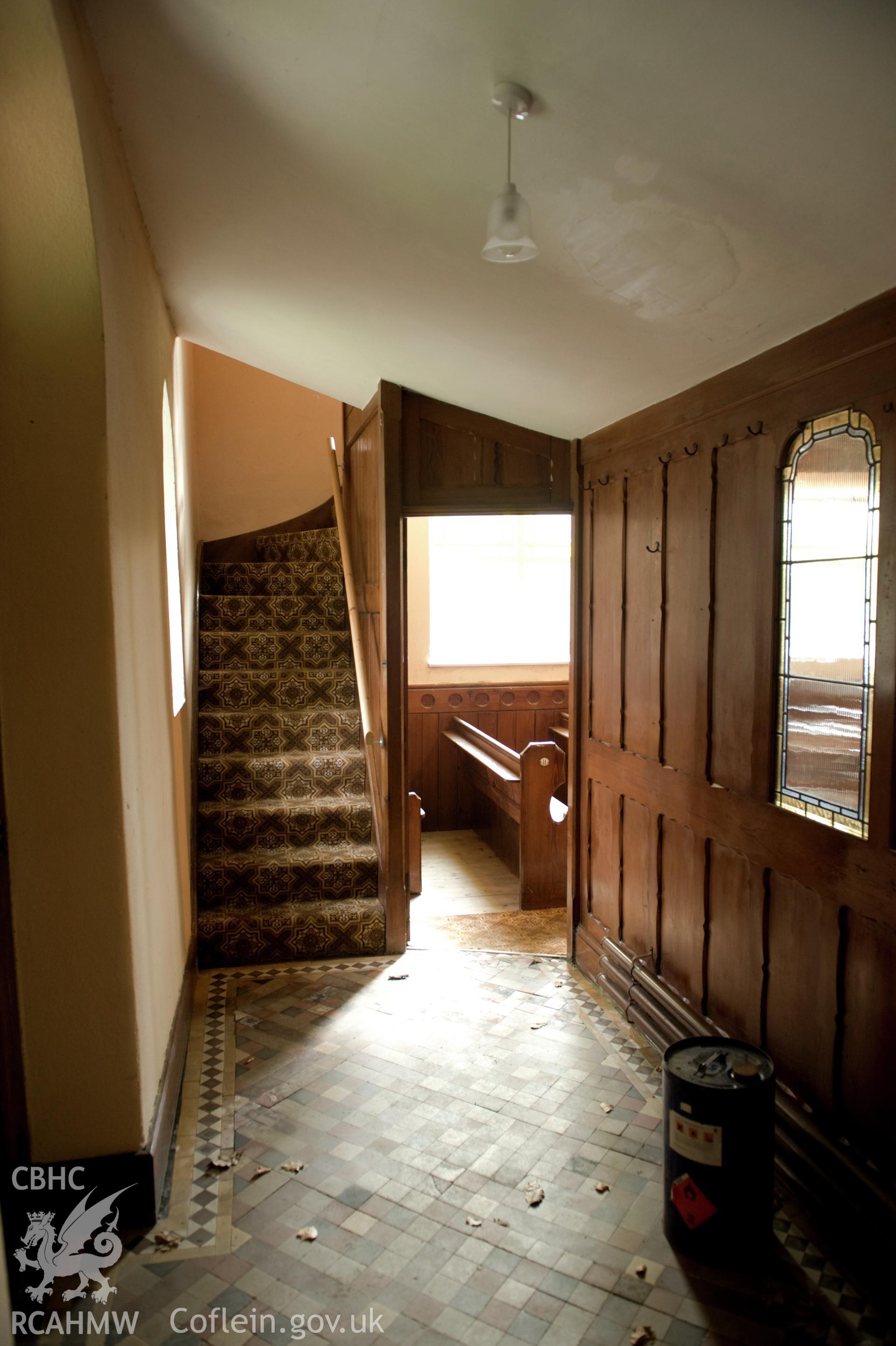 Digital image of interior: showing stairs and doorway.