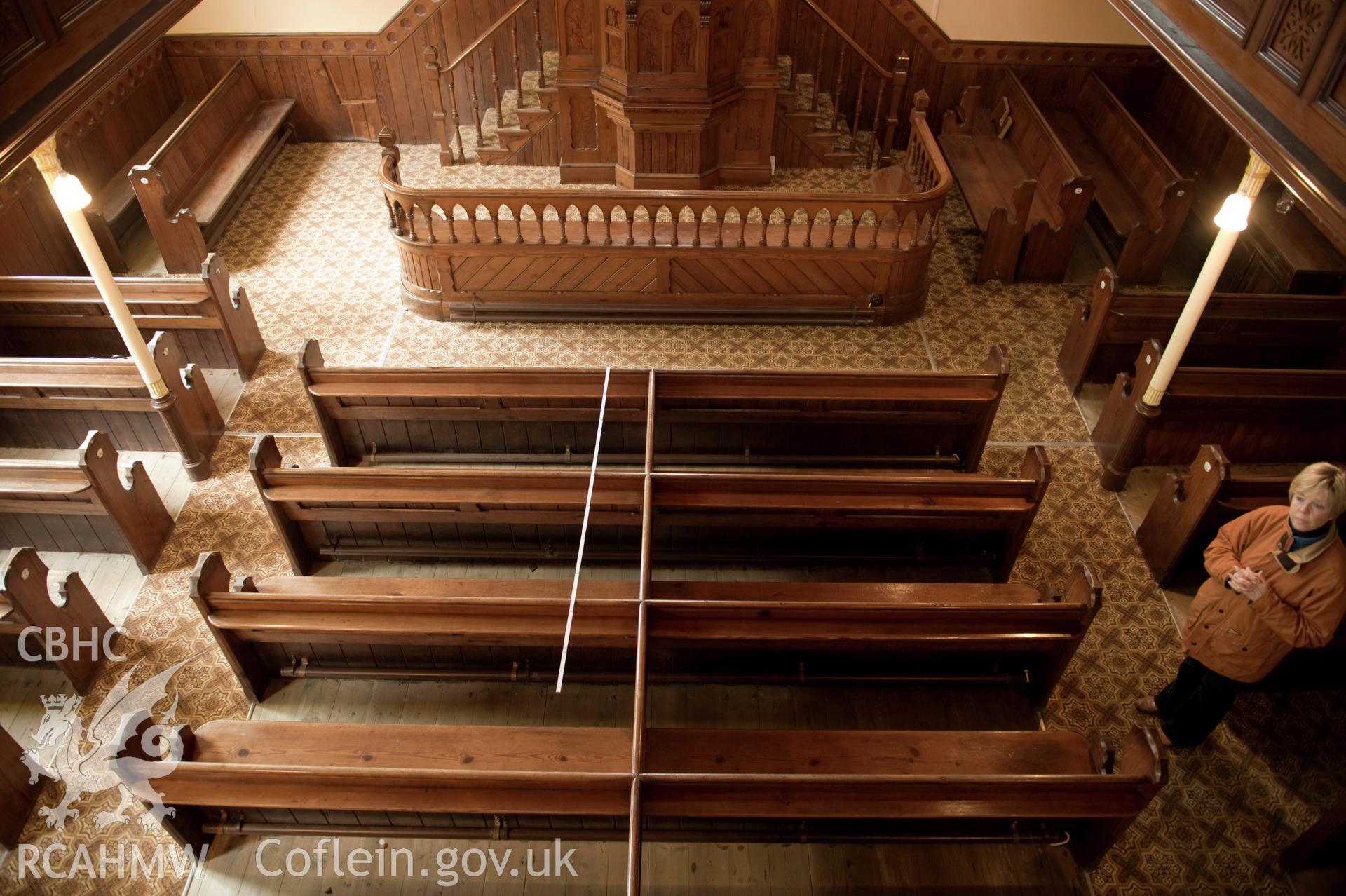 Digital image of interior with rule guide: ground floor pews, from first floor perspective.