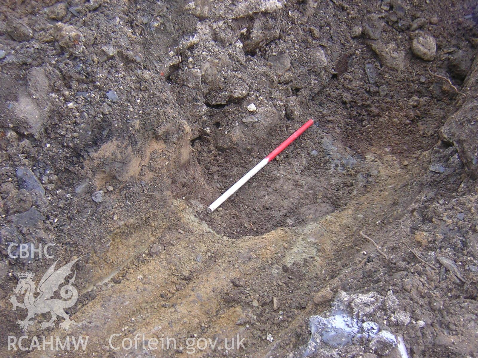 Plate 4: photograph showing view of foundation cut for modern building demolished prior to excavation, Looking north; part of Desk Based Research & Watching Brief for Red Lion Street, Tywyn Gwynedd', report no. 1128. Produced by Archaeology Wales in 2012.