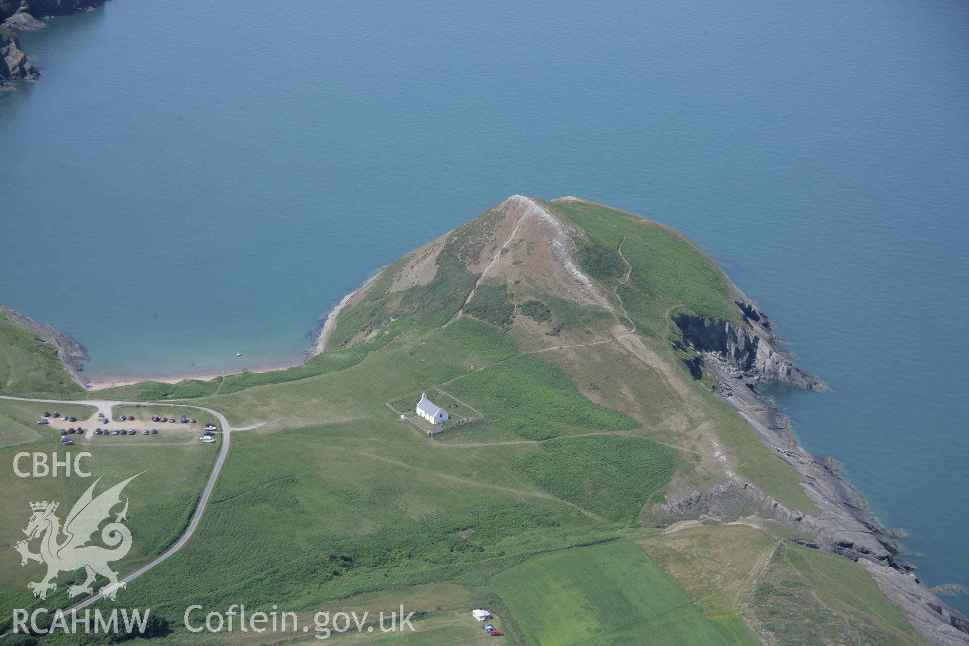 RCAHMW colour oblique aerial photograph of Foel y Mwnt from the east showing the church and parching of the fields. Taken on 11 July 2005 by Toby Driver