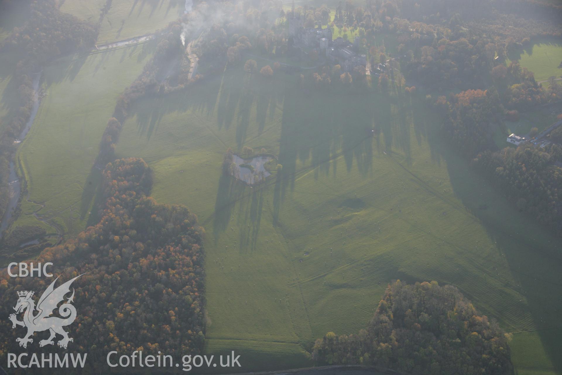 RCAHMW colour oblique aerial photograph of Penrhyn Castle Garden, Bangor, showing earthworks, viewed from the north-east. Taken on 21 November 2005 by Toby Driver