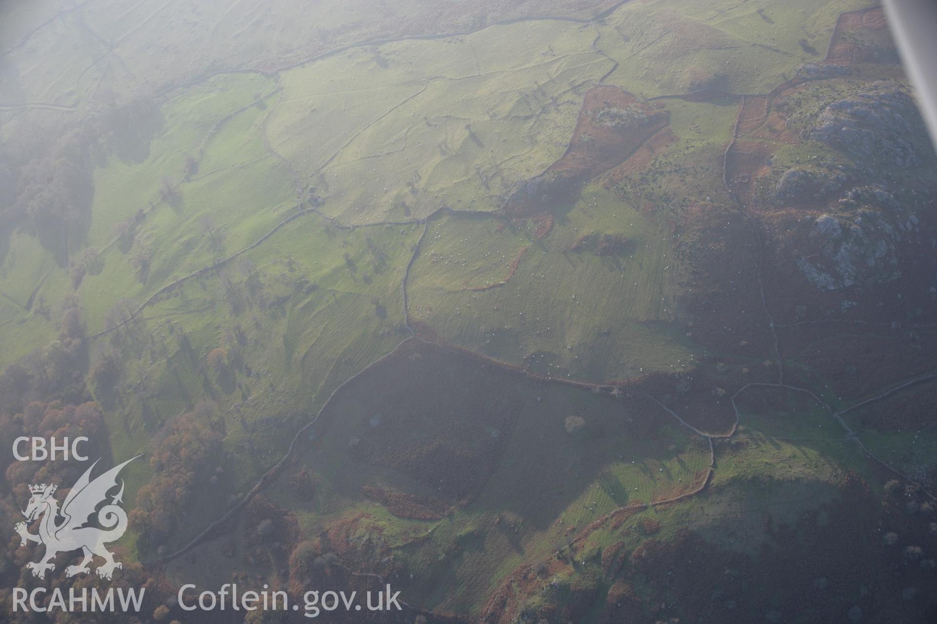 RCAHMW colour oblique aerial photograph of Caer Bach Hillfort. Taken on 21 November 2005 by Toby Driver