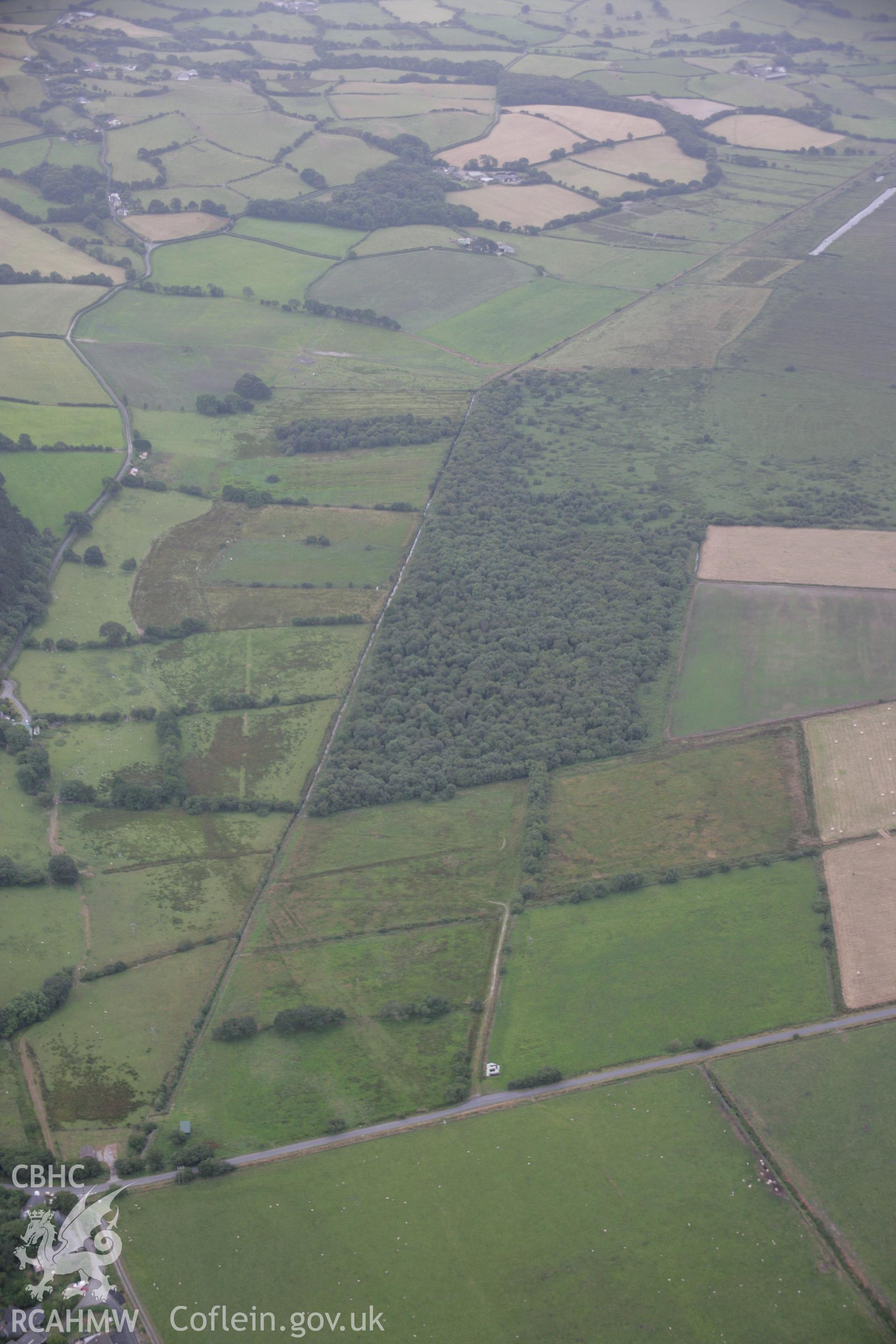 RCAHMW digital colour oblique photograph of possible earthworks of timber trackways at Tan-yr-Allt, Tre Taliesin looking south-west. Taken on 18/07/2005 by T.G. Driver.
