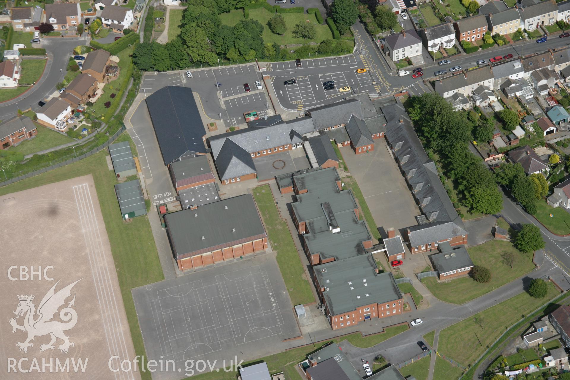 RCAHMW colour oblique aerial photograph of Glan-y-Mor Comprehensive School from the west. Taken on 09 June 2005 by Toby Driver