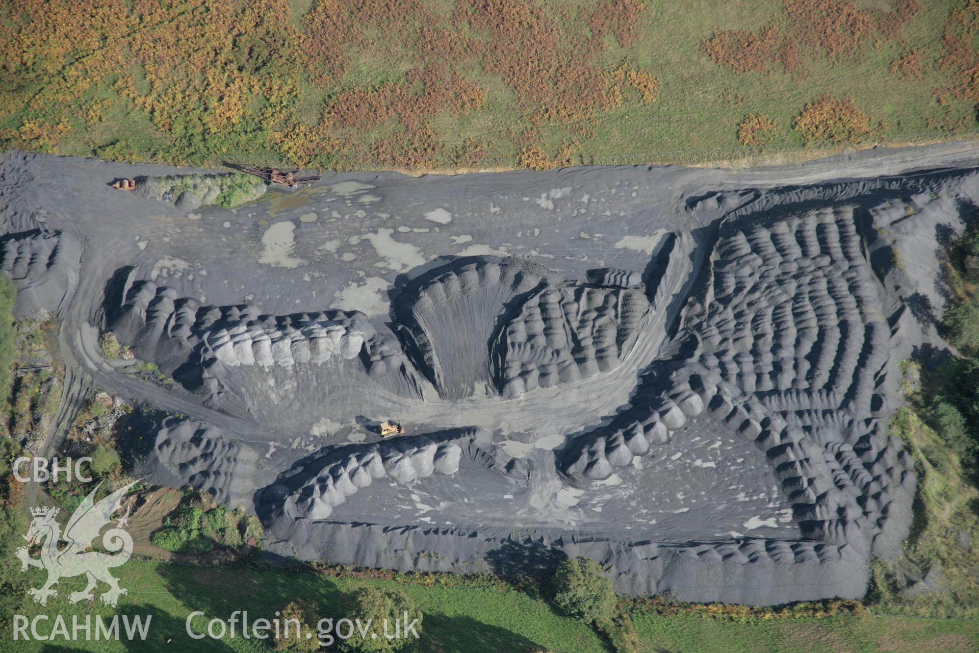 RCAHMW colour oblique aerial photograph showing tips of Cribarth quarry, from the west. Taken on 13 October 2005 by Toby Driver