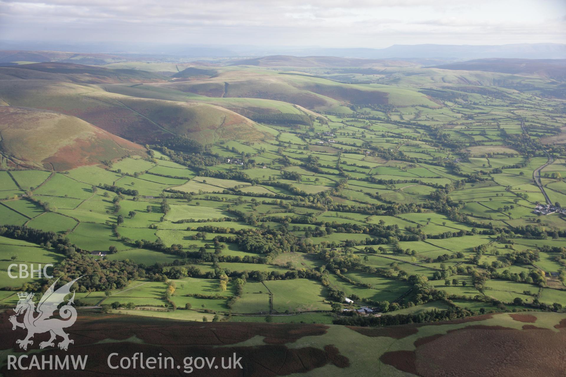 RCAHMW colour oblique aerial photograph of St Tecla's Church, Llandegley. A wide landscape view from the north-west. Taken on 13 October 2005 by Toby Driver