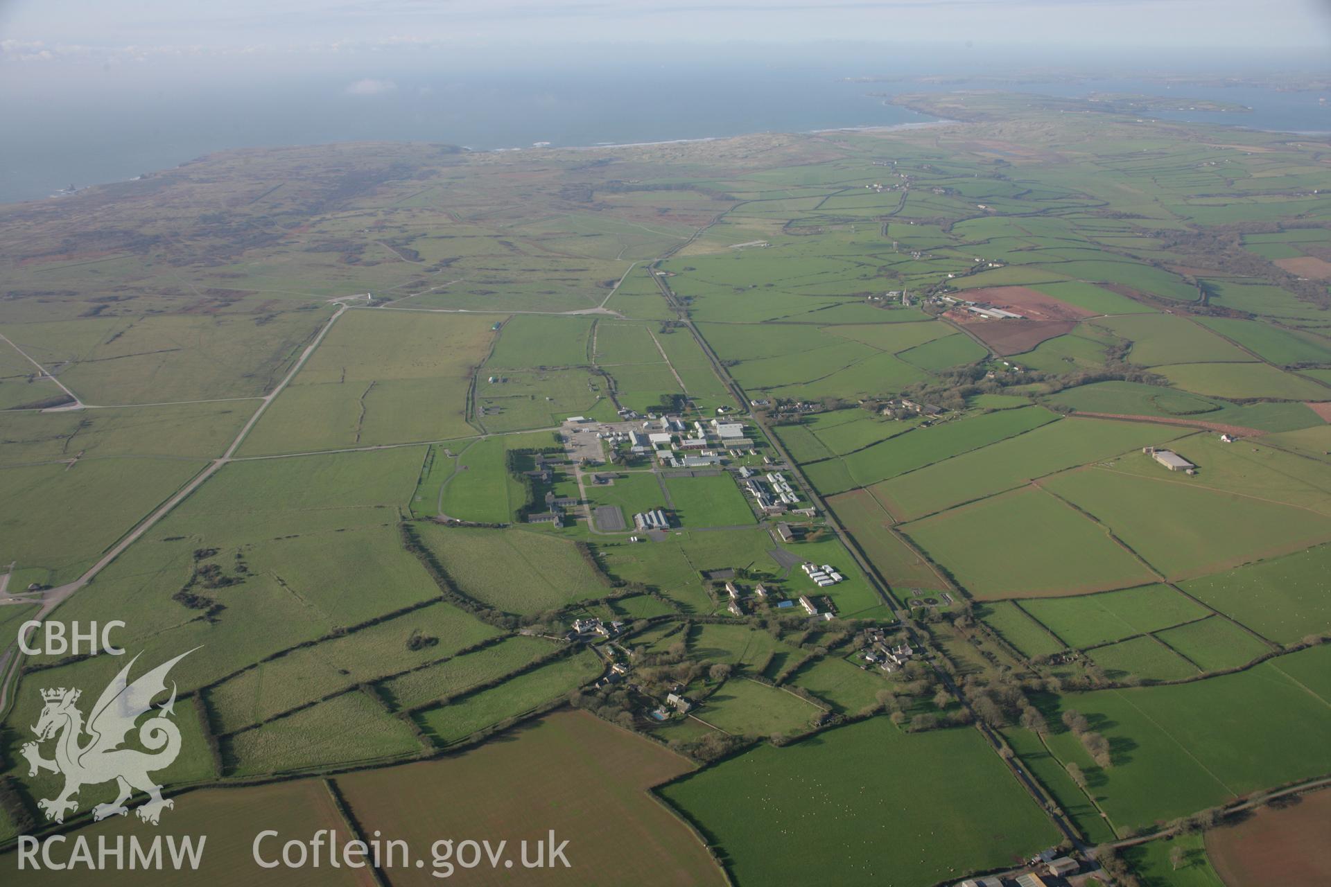 RCAHMW colour oblique aerial photograph of Merrion Camp, Castlemartin Training Area in panoramic landscape view from the east. Taken on 19 November 2005 by Toby Driver