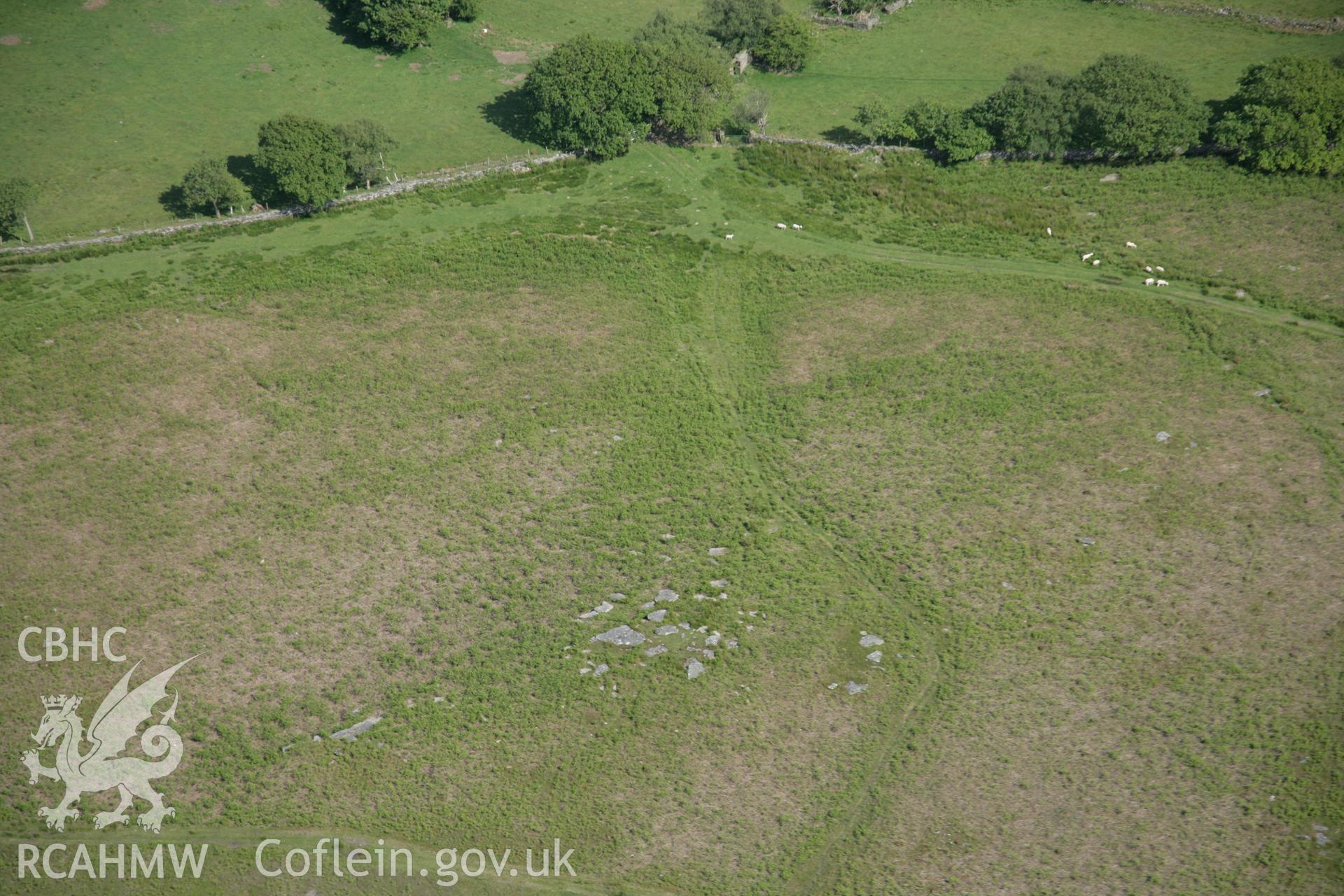 RCAHMW colour oblique aerial photograph of Graig Fawr Chambered Tomb from the west. Taken on 09 June 2005 by Toby Driver
