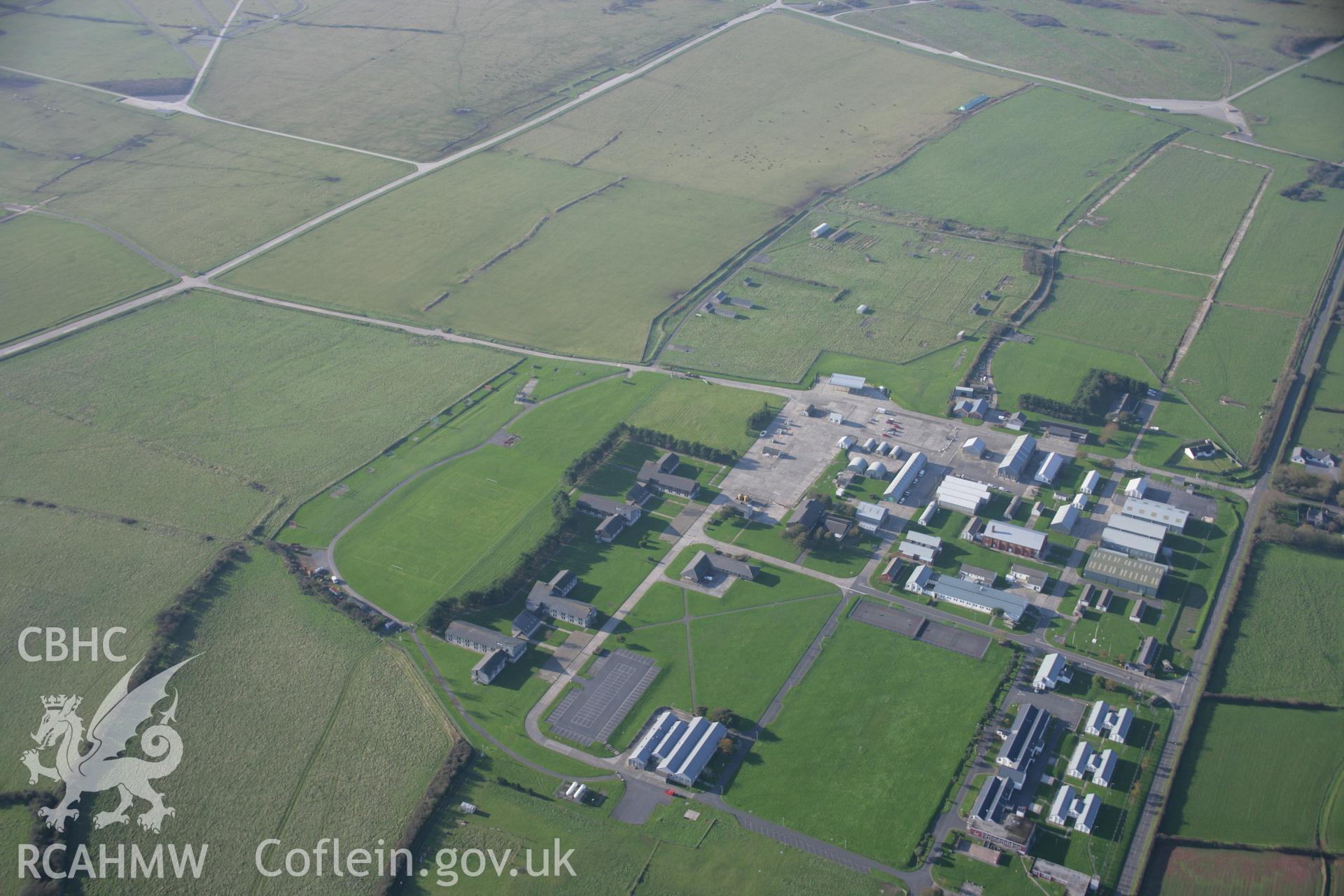 RCAHMW colour oblique aerial photograph of Merrion Camp defended enclosure, Castlemartin Training Area, viewed from the south east. Taken on 19 November 2005 by Toby Driver