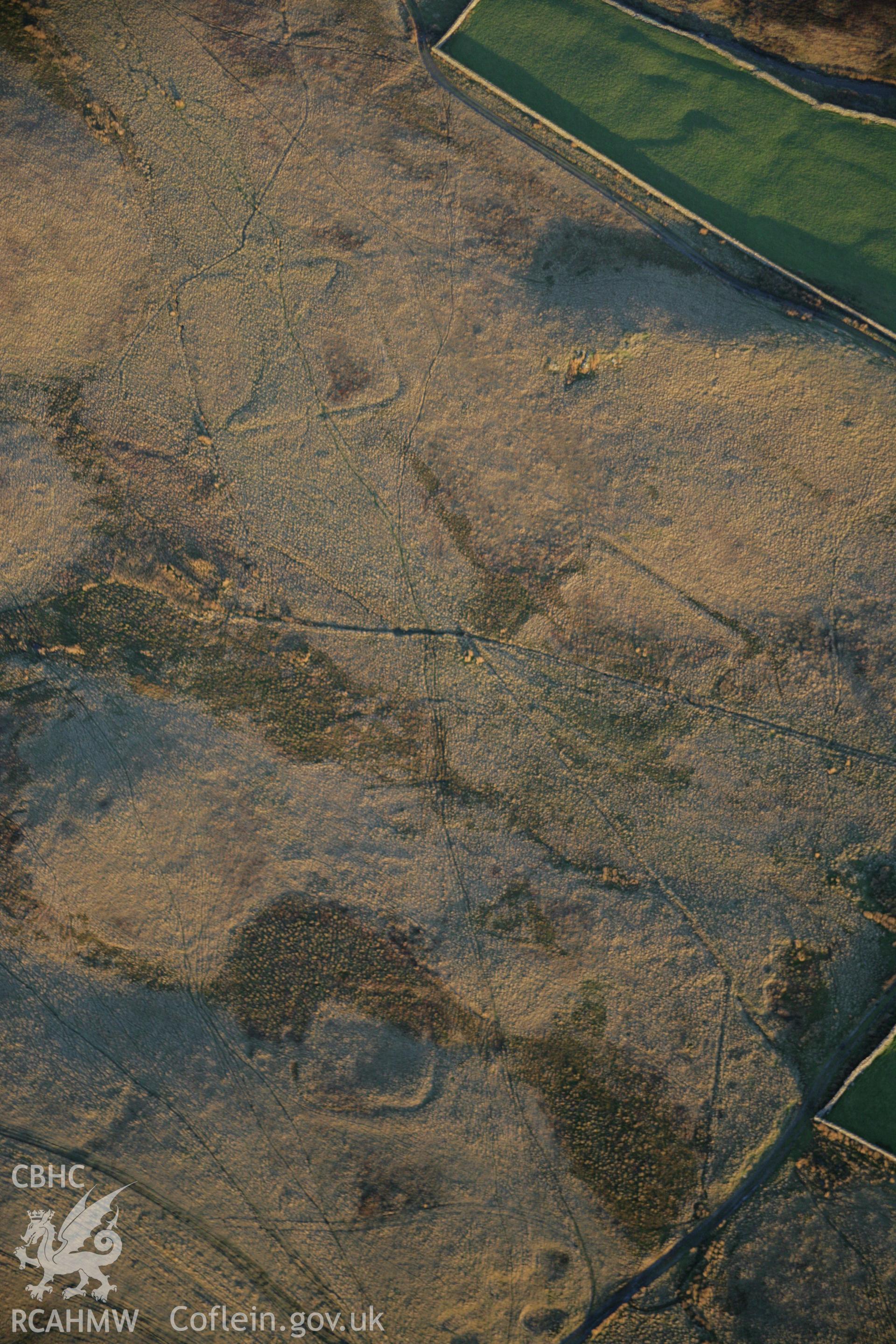 RCAHMW colour oblique aerial photograph of Roman practice camps, Dolddinas III, IV and V viewed from the west. Taken on 21 November 2005 by Toby Driver