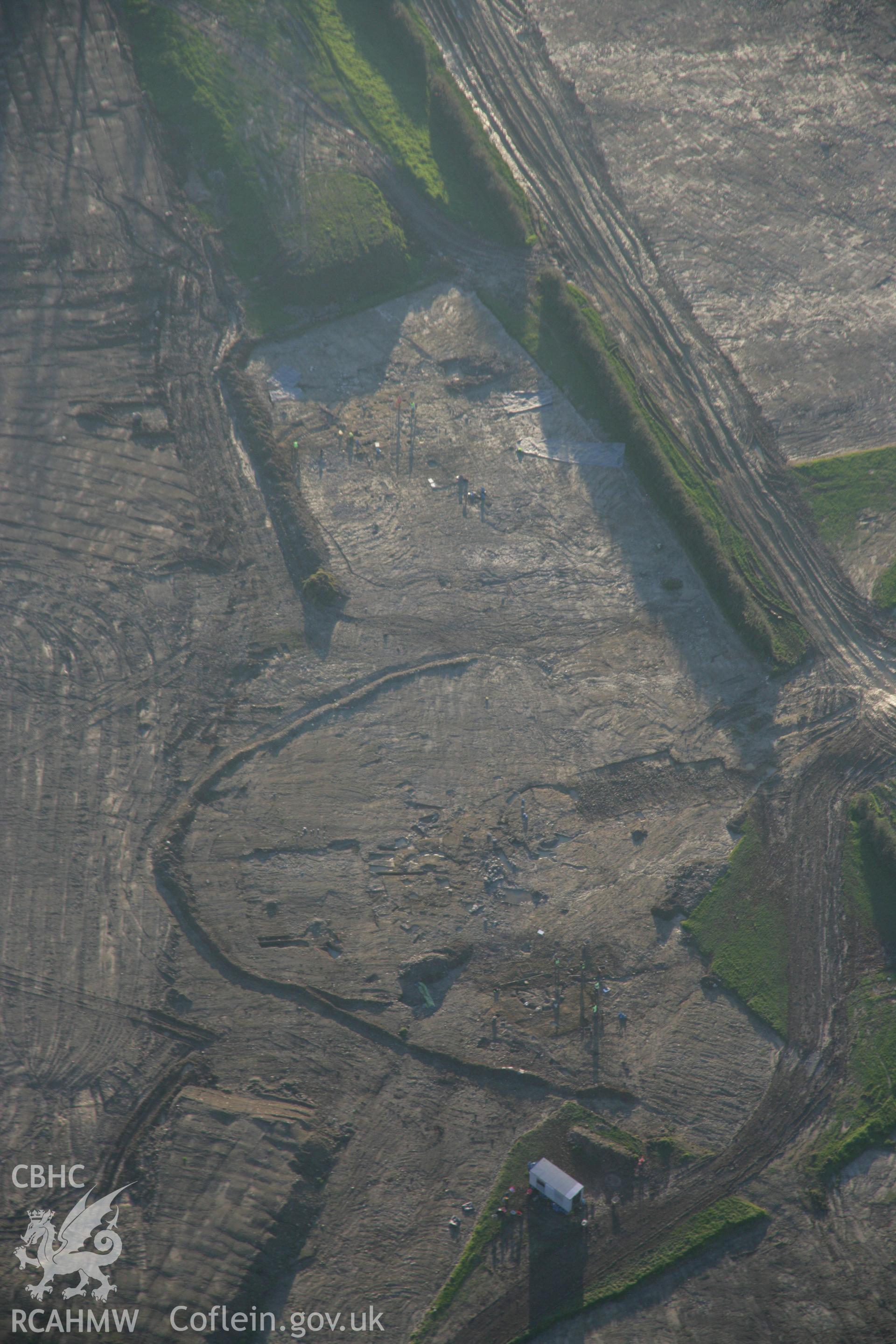 RCAHMW colour oblique aerial photograph of Parc Bryn Cegin prehistoric settlements under excavation by Gwynedd Archaeological Trust, detailed viewed looking to the south. Taken on 21 November 2005 by Toby Driver